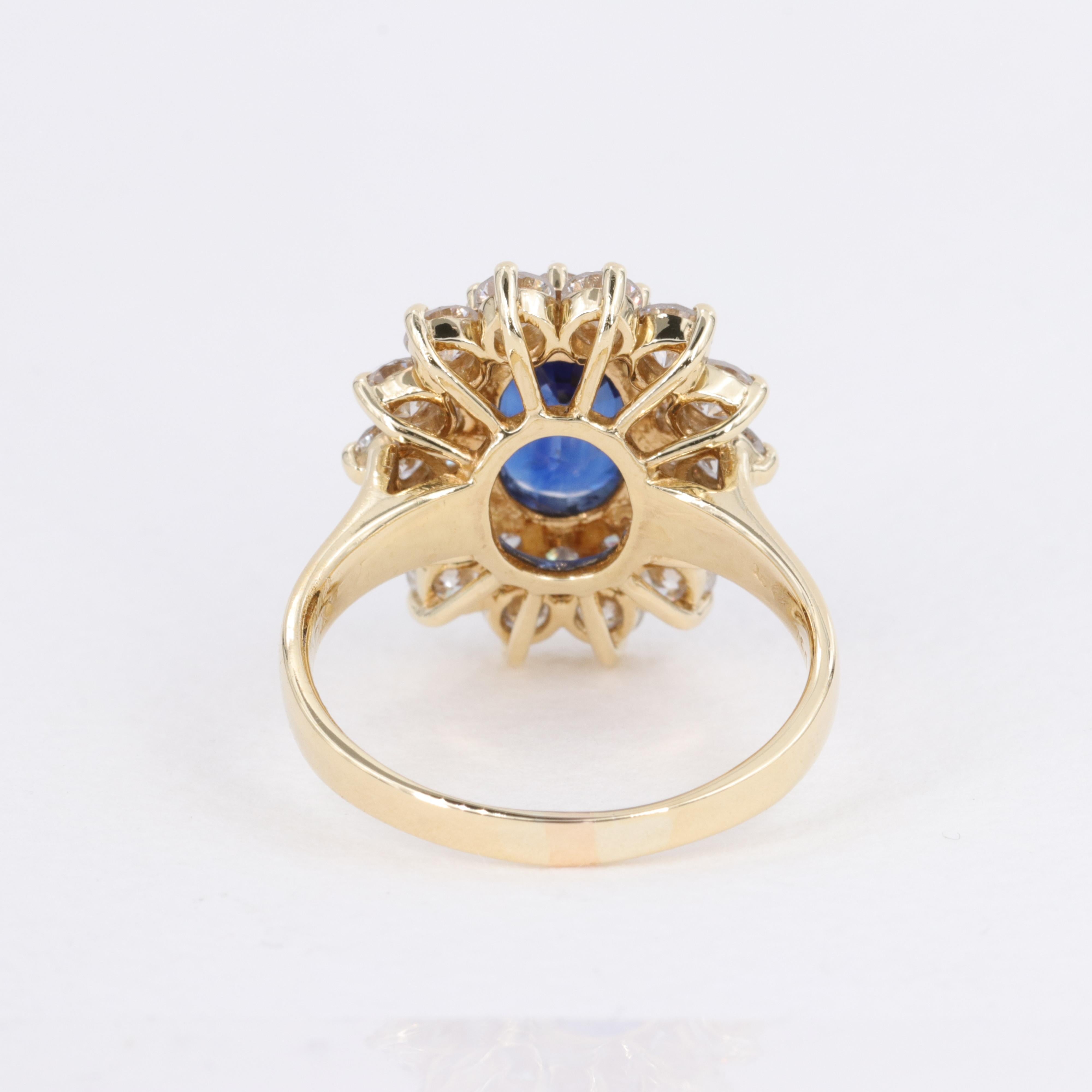 Blue Sapphire Oval and Diamond Halo Ring by Mayors in 18 Karat Yellow Gold For Sale 1