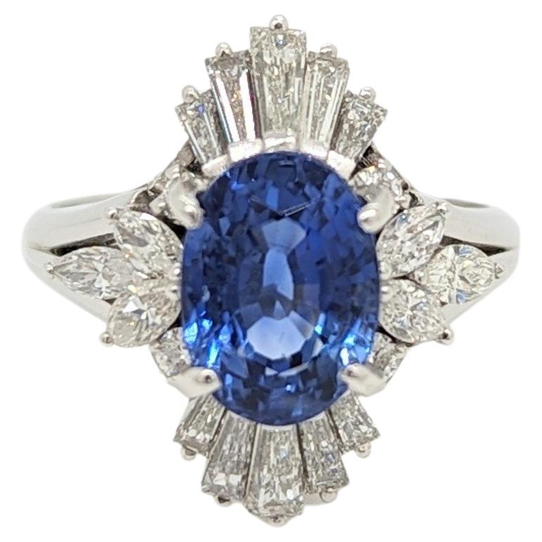 Blue Sapphire Oval and White Diamond Cluster Ring in Platinum