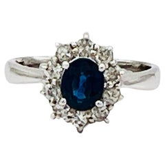 Blue Sapphire Oval and White Diamond Cluster Ring in Platinum