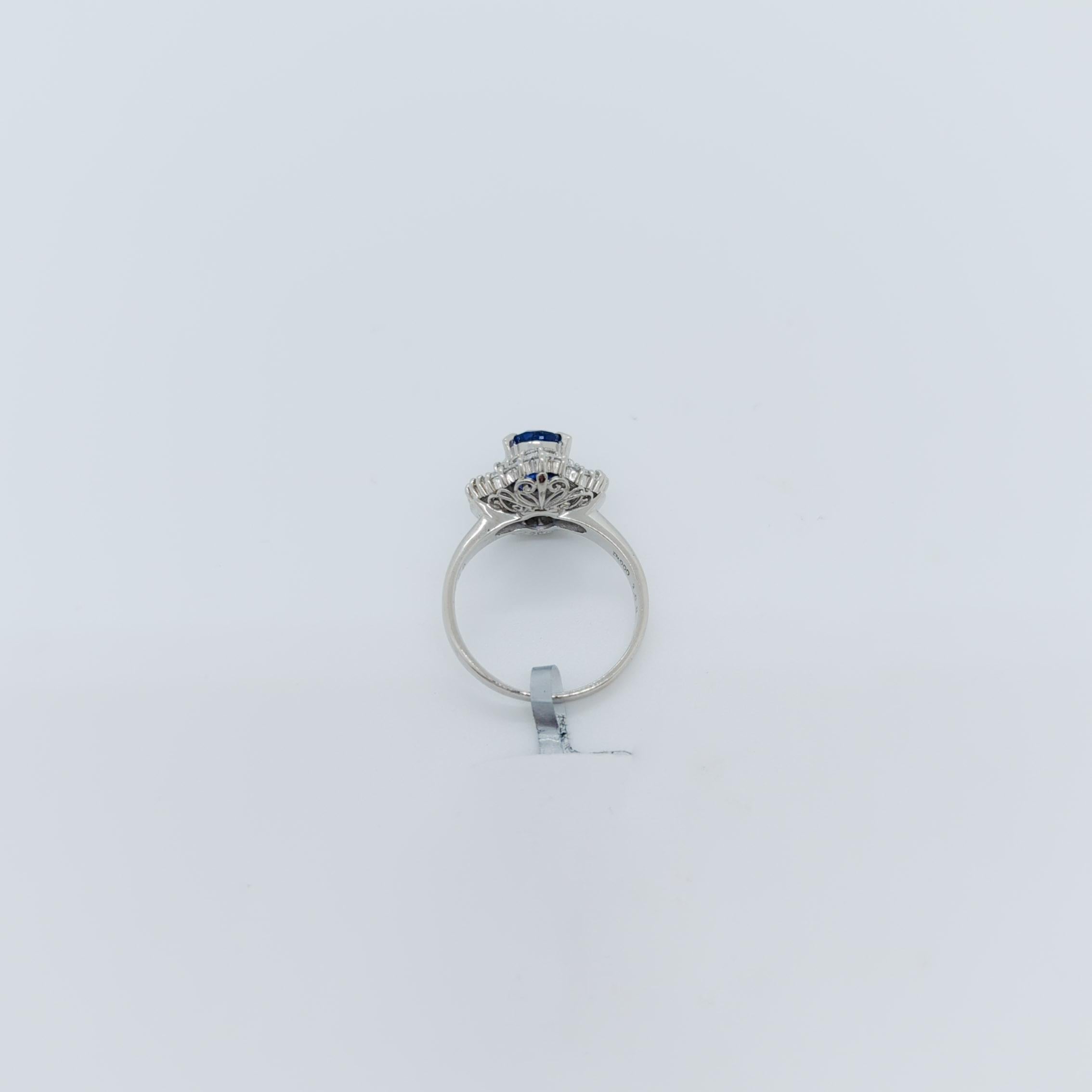 Women's or Men's Blue Sapphire Oval and White Diamond Cocktail Ring in Platinum For Sale