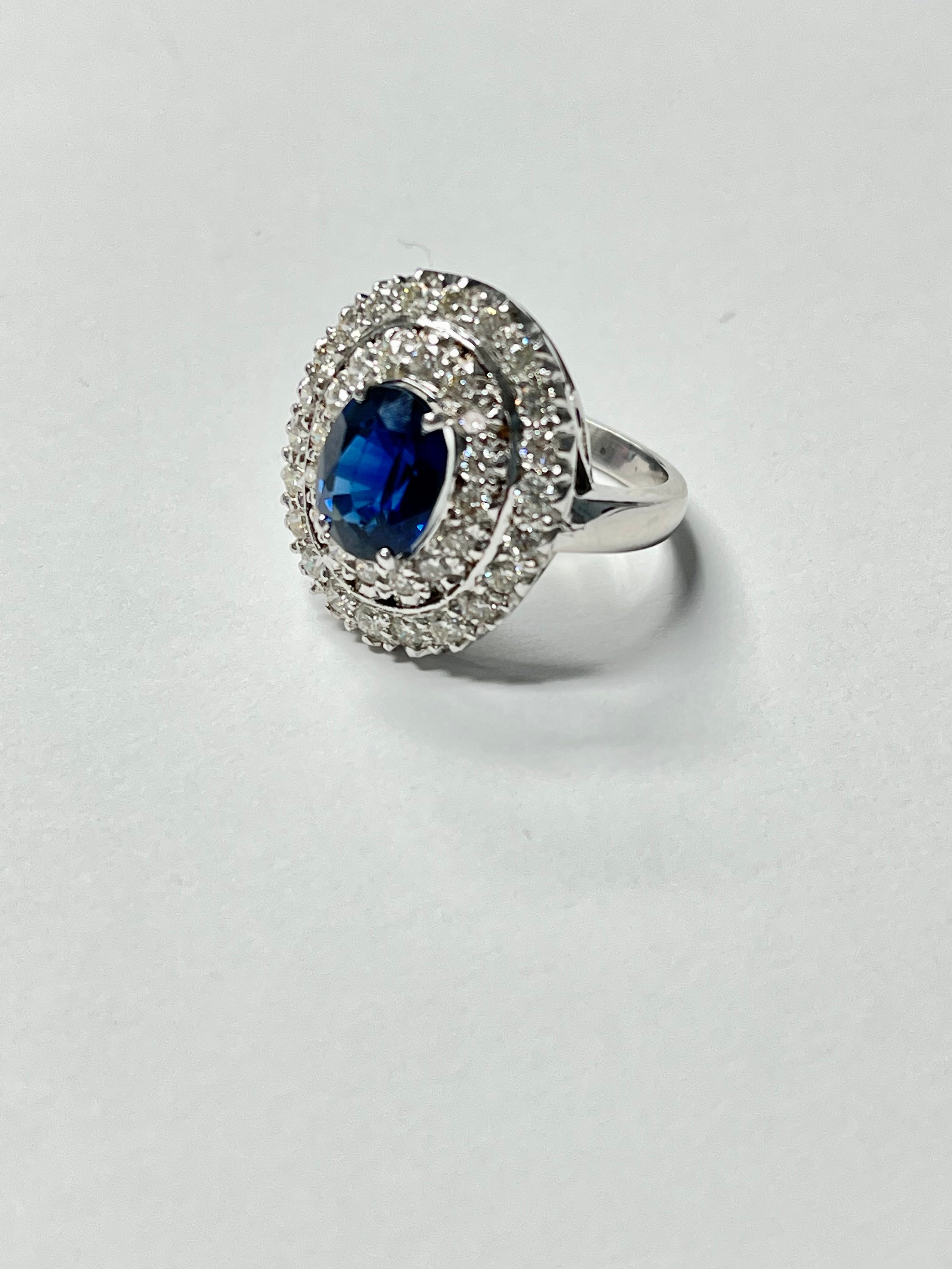 Blue sapphire and diamond engagement ring beautifully handcrafted in 18k White Gold. 
The details are as follows : 
Blue sapphire weight : 3.21 carat 
Diamond weight : 0.90 carat ( GH color and VS clarity ) 
Metal : 18k white gold
Gold weight : 9.21
