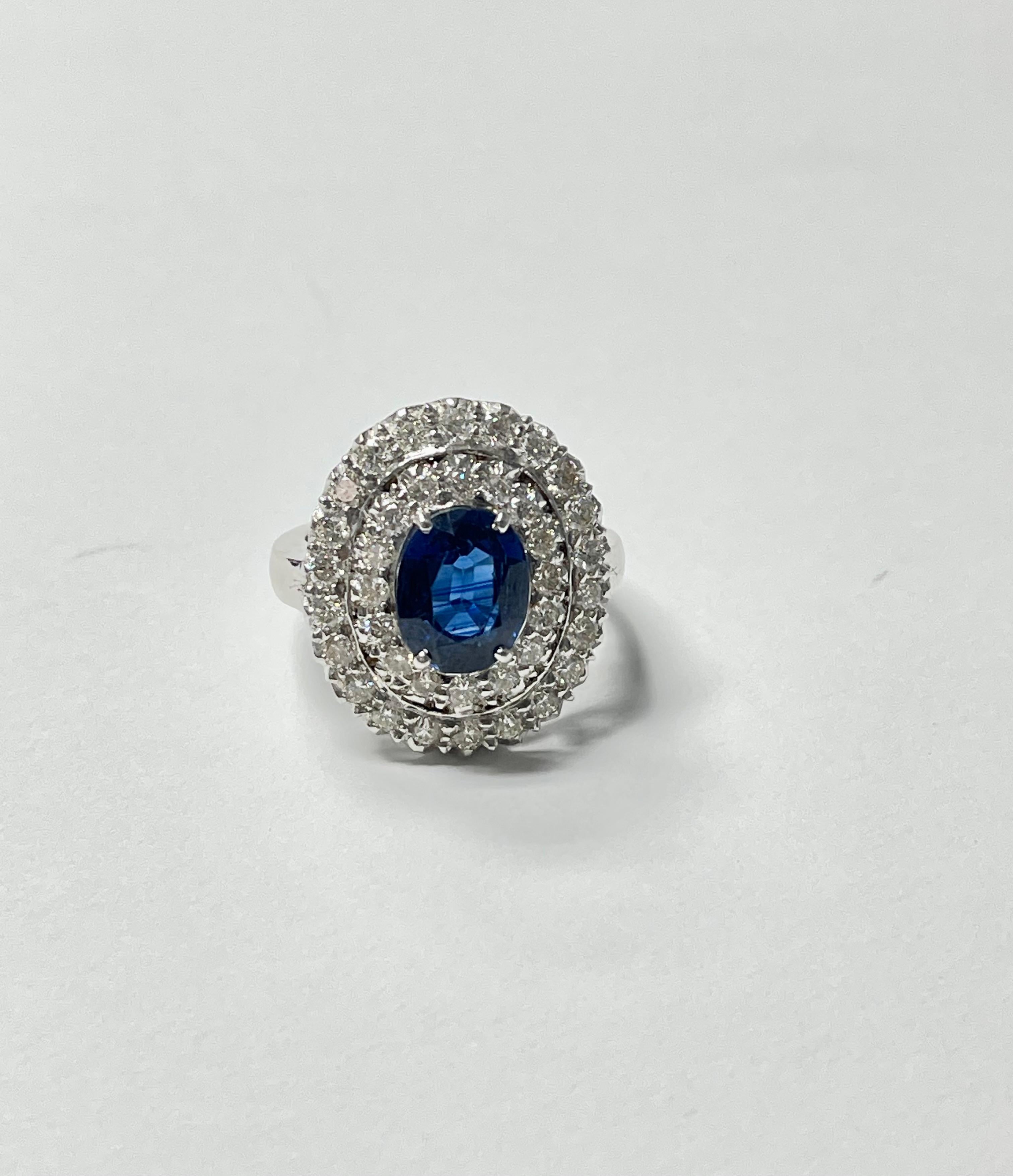 Blue Sapphire Oval and White Diamond Engagement Ring In 18K White Gold.  In New Condition For Sale In New York, NY