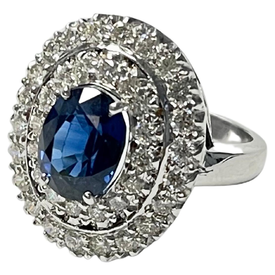 Blue Sapphire Oval and White Diamond Engagement Ring In 18K White Gold. 