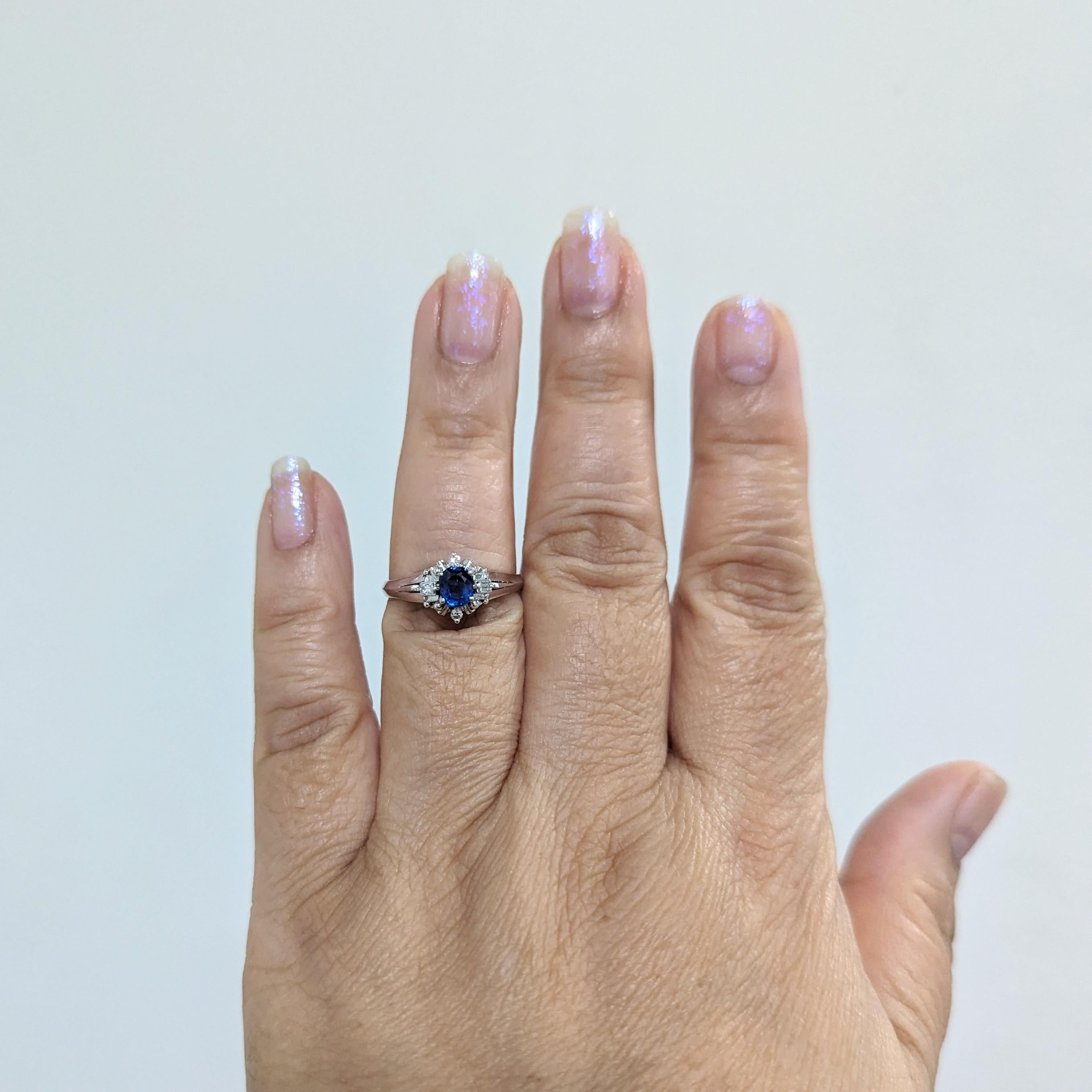Beautiful 0.52 ct. blue sapphire oval with 0.11 ct. white diamond rounds and baguettes.  Handmade in platinum.  Ring size 8.