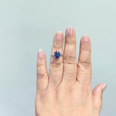 Blue Sapphire Oval and White Diamond Solitaire Ring in Platinum