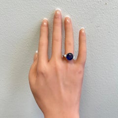 Blue Sapphire Oval and White Diamond Three Stone Ring in Platinum