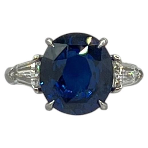 Blue Sapphire Oval and White Diamond Three Stone Ring in Platinum
