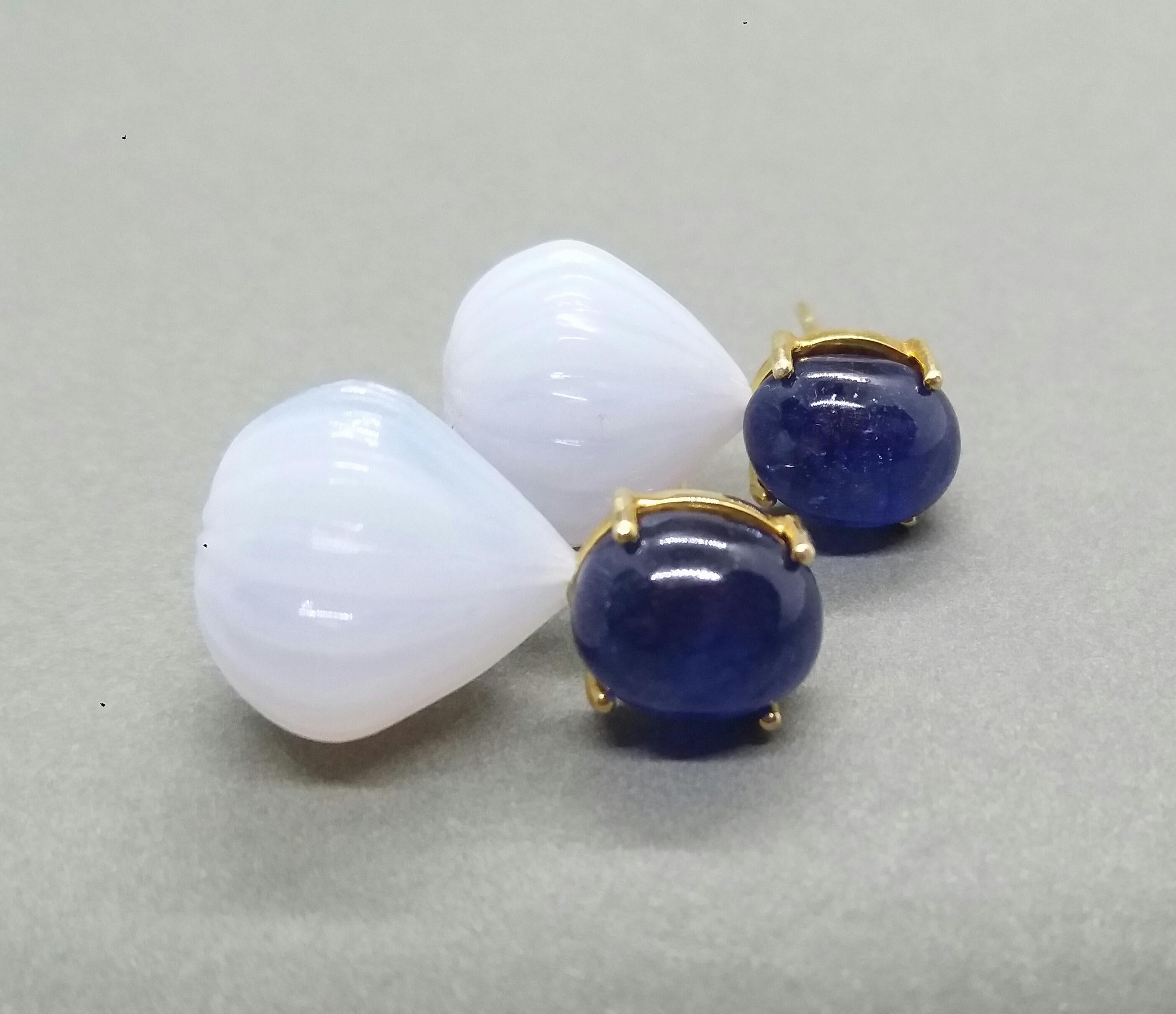 Simple chic stud earrings with a pair of Blue Sapphire  oval cabochon size 10 x 11 mm set in 14 kt solid yellow gold on the top and 2 Chalcedony carved round drops of  16 mm in diameter

In 1978 our workshop started in Italy to make simple-chic Art