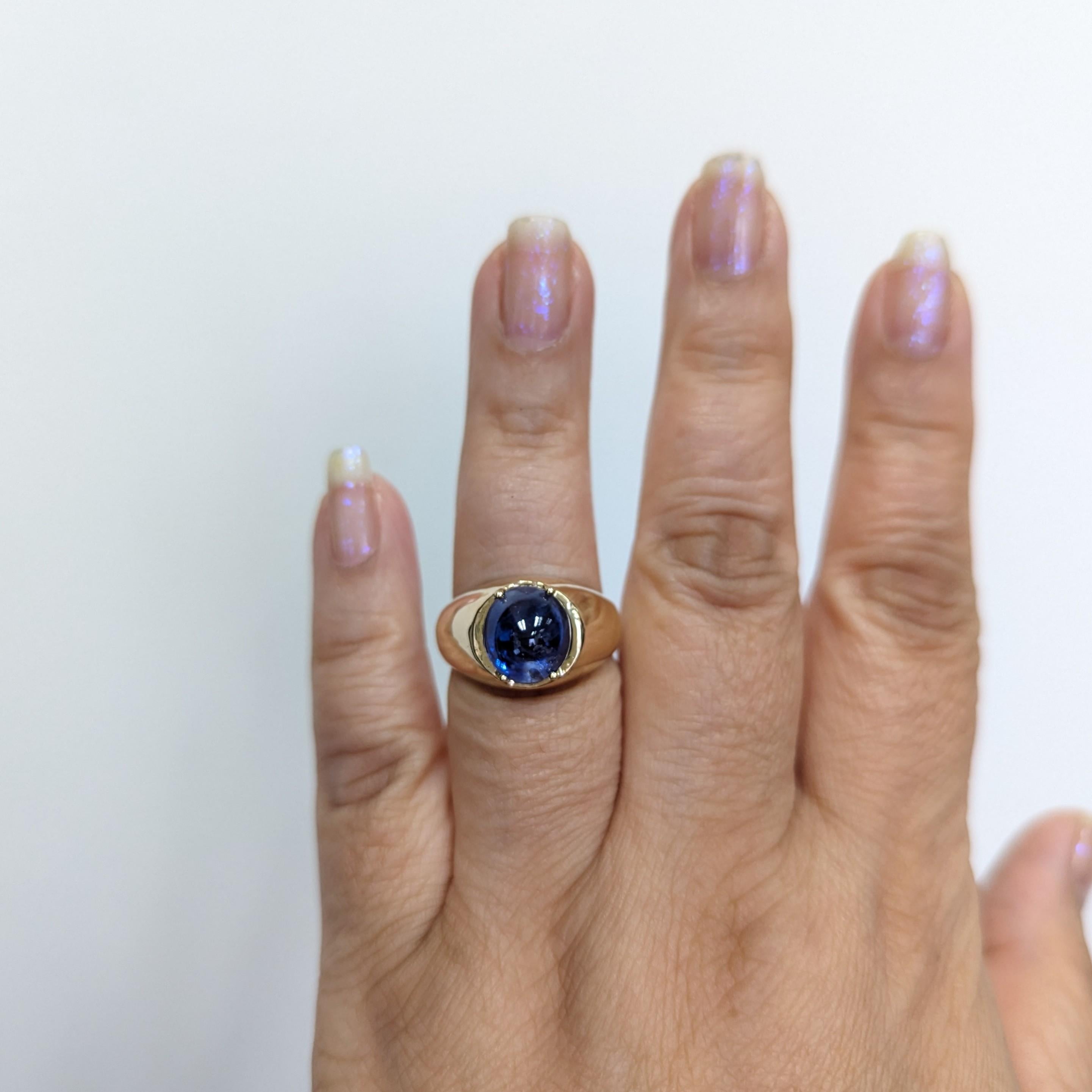 Beautiful 6.59 ct. blue sapphire oval cabochon handmade in 14k yellow gold.  Ring size 7.75.