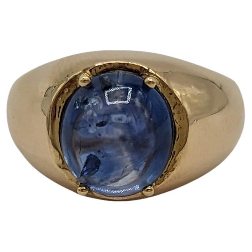 Bague dôme en or jaune 14 carats avec cabochon ovale de saphir bleu