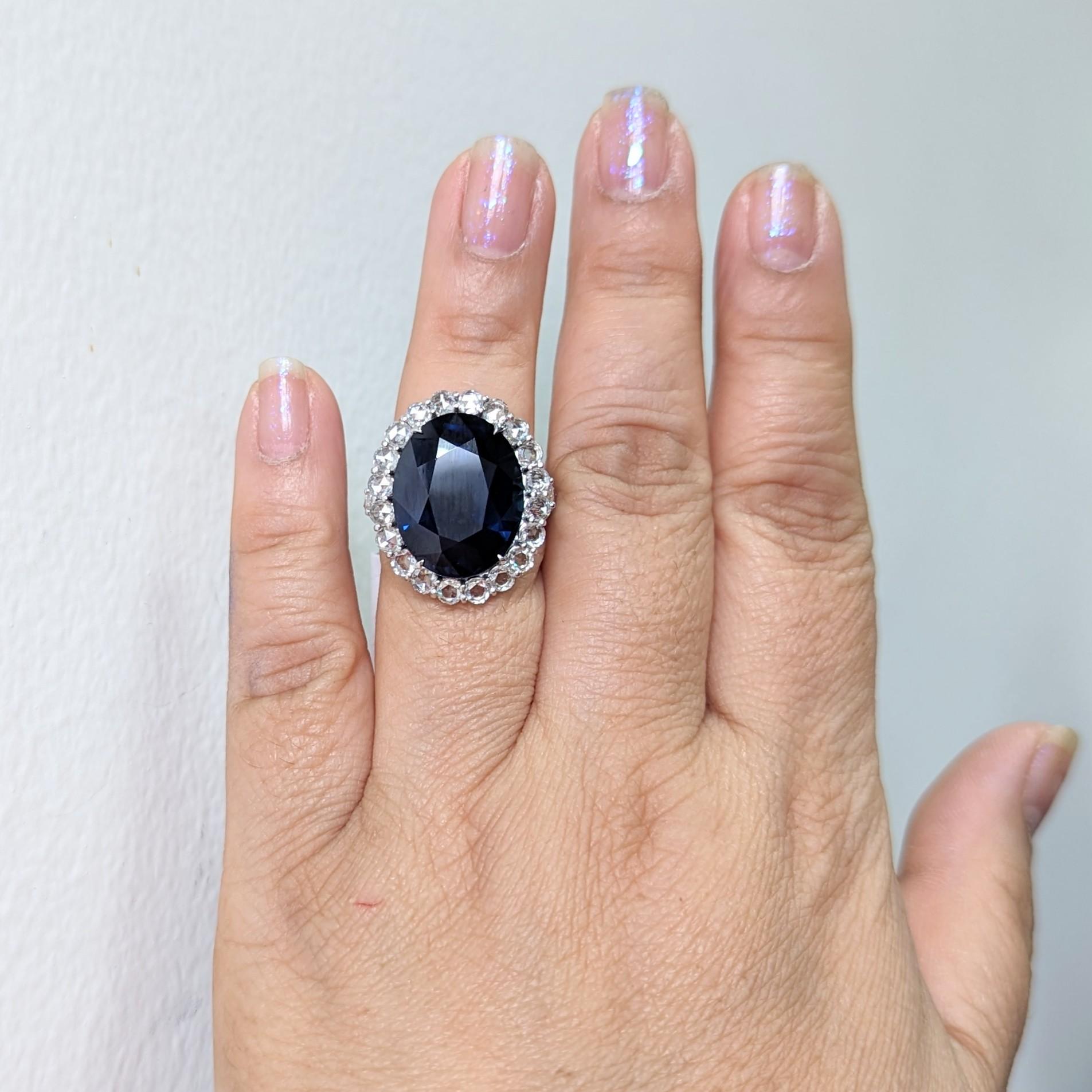 This Blue Sapphire ring is a statement piece with beautiful rosecut diamonds surrounding the stone and on the band.  A classic design with a twist using rosecuts instead of faceted diamonds.  This delicate yet powerful piece is made out of platinum