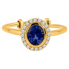 Bague en or jaune 18 carats avec saphir bleu ovale et diamants