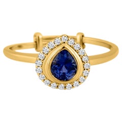 Bague en or jaune 18 carats avec saphir bleu ovale et diamants