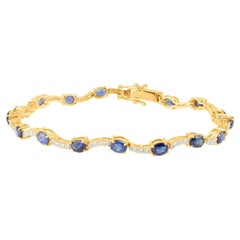 Rond-Armband aus 18 Karat Gelbgold mit blauem Saphir, ovalem und Diamant