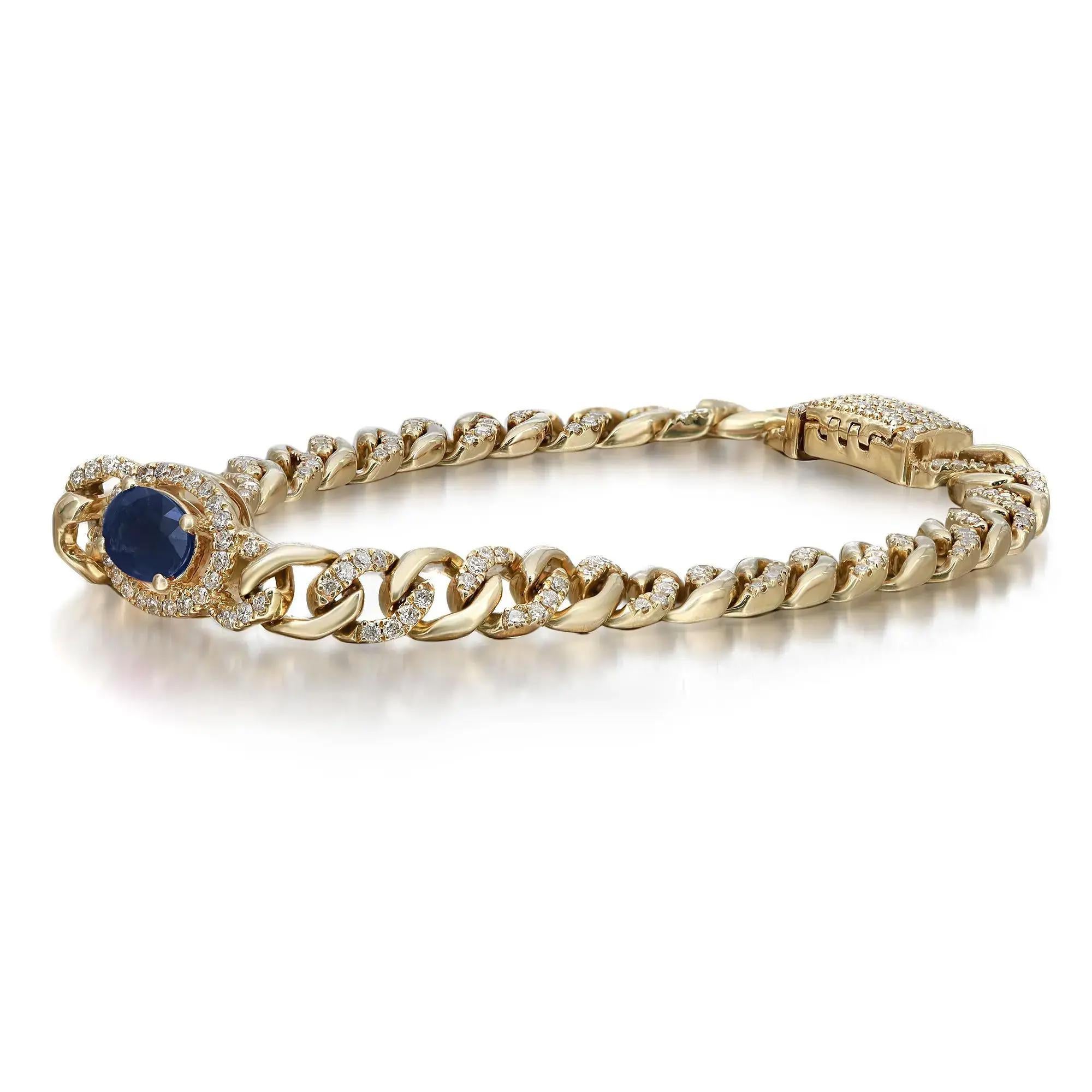 This beautifully crafted chain bracelet features a prong set oval shaped Blue Sapphire in the center with a round cut diamond halo attached to a pave set round diamond studded Cuban link chain. Crafted in 14k yellow gold. Total ruby weight: 0.94