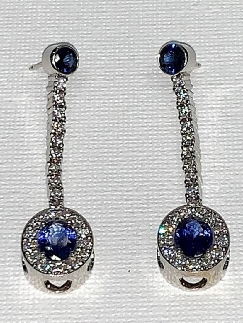 Blue Sapphire, White Pavé Diamond, White Gold Earrings, Belle Epoque Era.

Featuring a pair of Blue Sapphire Earrings with White Pavé Diamonds, set in 18K White Gold. 

This one-of-a-kind pair of earrings was created by hand and in CAD, Computer