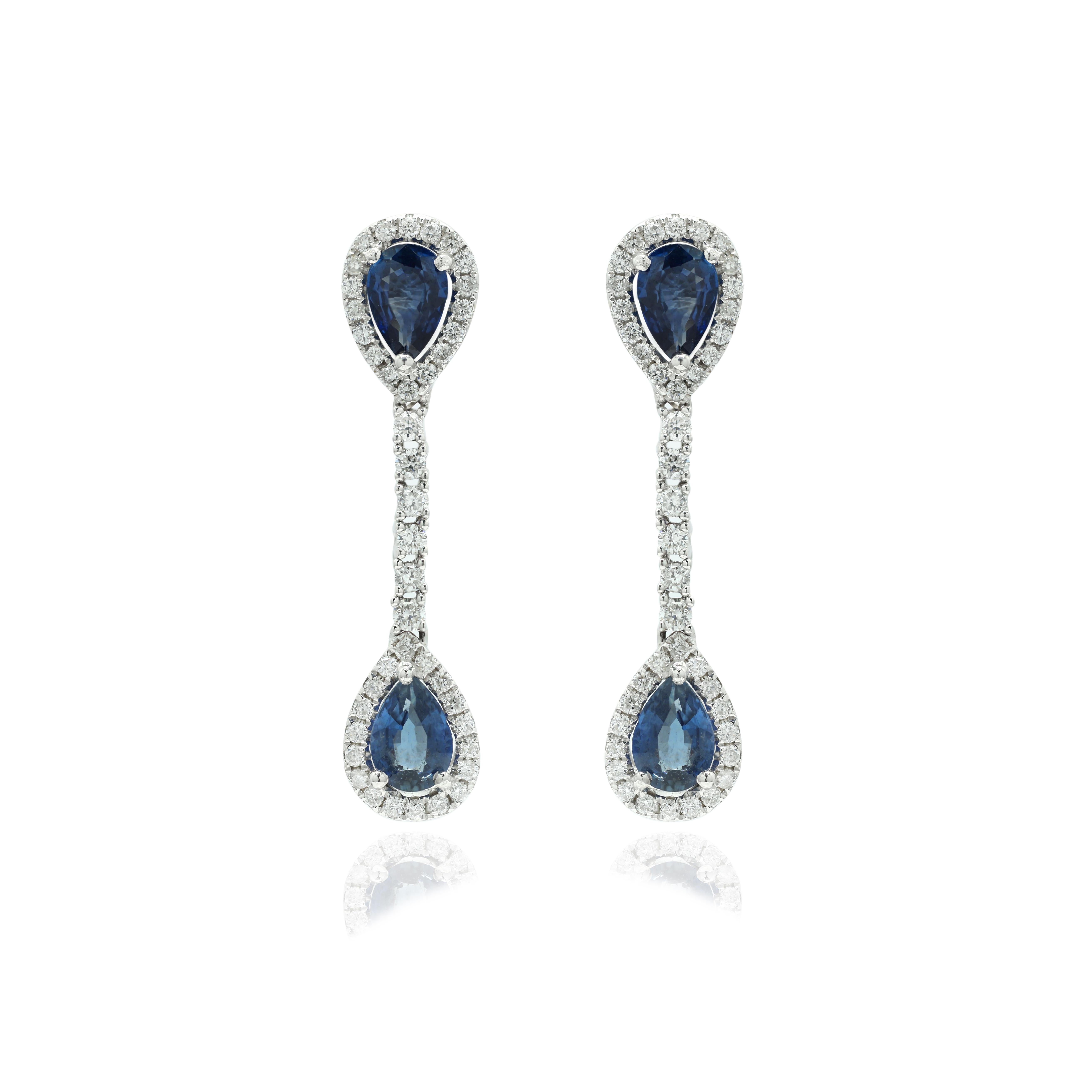 Contemporary Blue Sapphire Pear Drop Dangle Earrings Studded with Diamonds in 14K White Gold For Sale