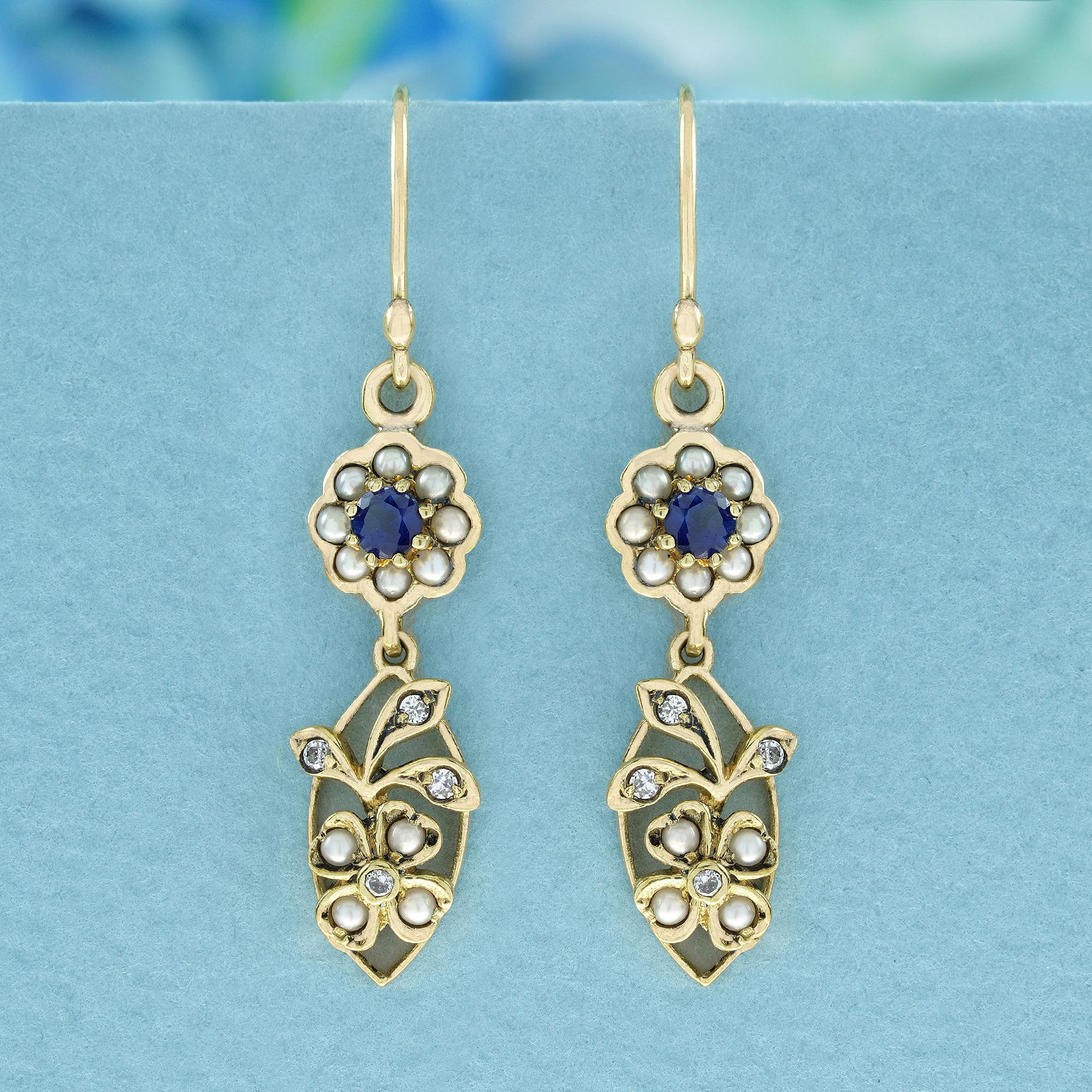 The Vintage Style yellow gold earrings feature a top tier floral cluster design. Each earring is composed of multiple shiny round white pearls and a round and faceted Blue Sapphire gemstone at its center, and a bottom tier floral cluster is composed