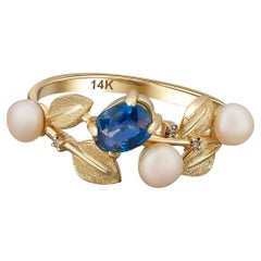 Blue sapphire, pearl, diamonds 14k gold ring. 