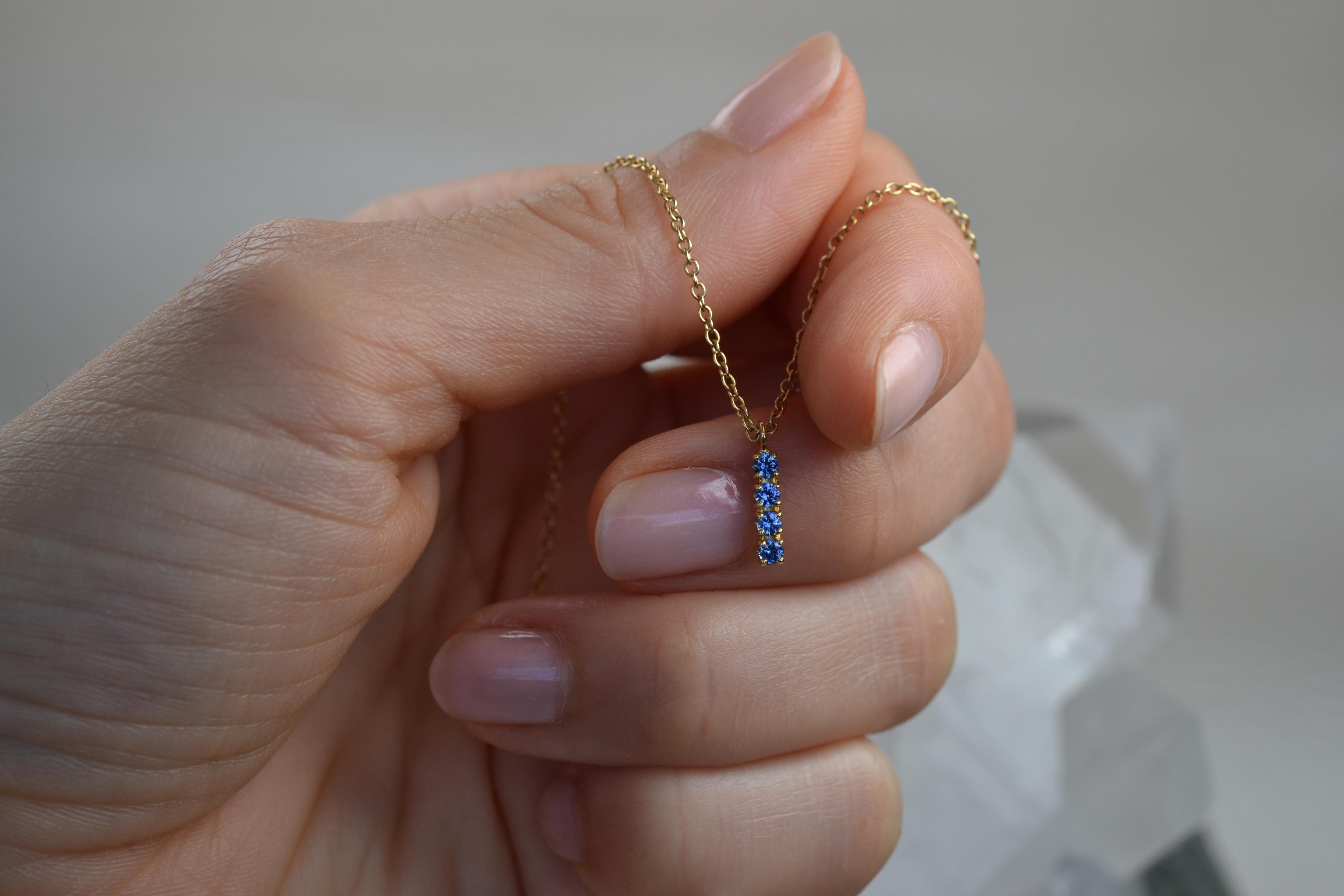 Contemporary Blue Sapphire Pendant in 18 Karat Yellow Gold For Sale