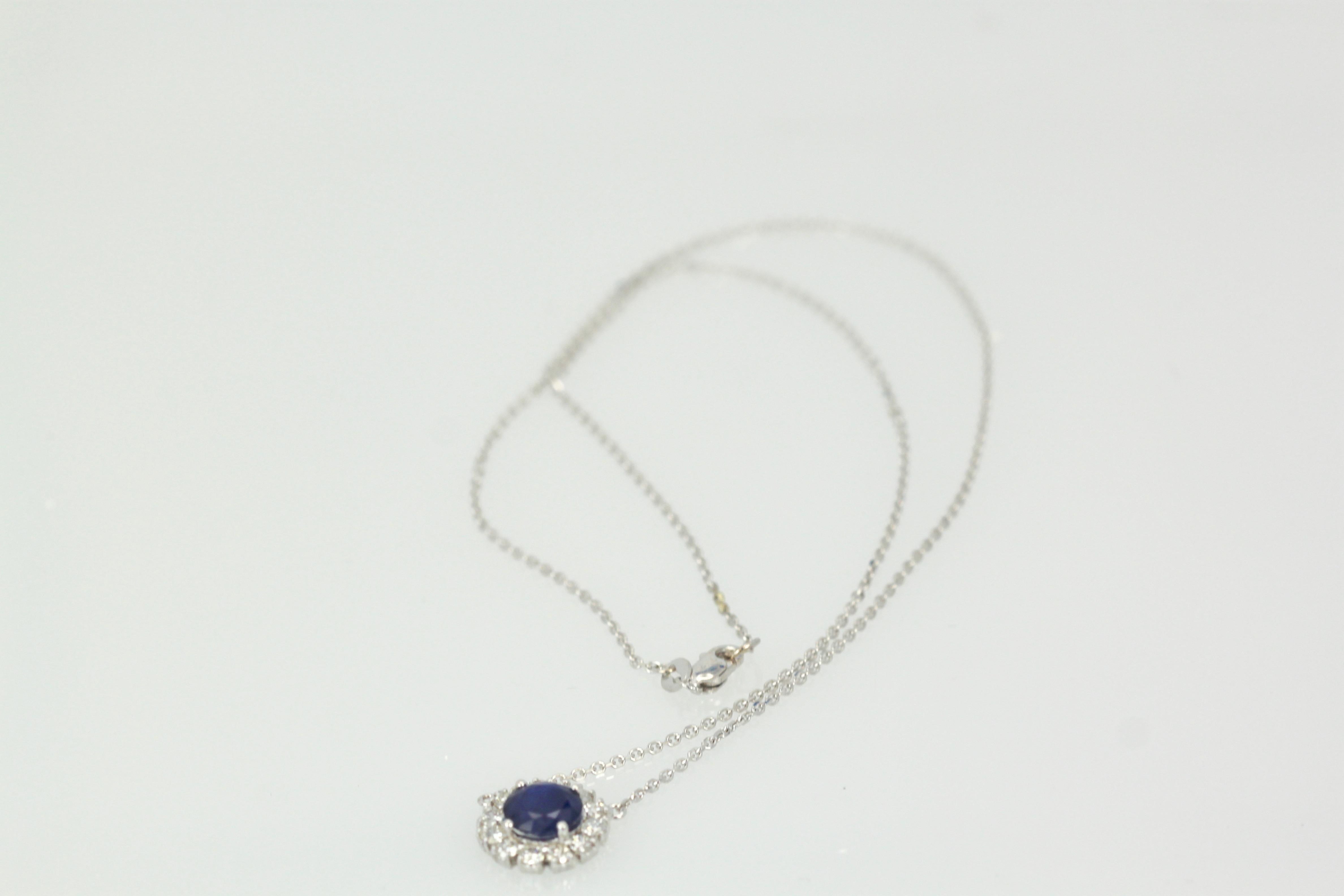 This Blue Sapphire Pendant with Diamond surround is simple sweet but packs a punch.  The Sapphire is 12.49mm round and weights 1.65 Carats, the Diamonds weight 0.80 carats and is stamped 750, 18K.  The gross weight is 3.2 grams.  This is new and