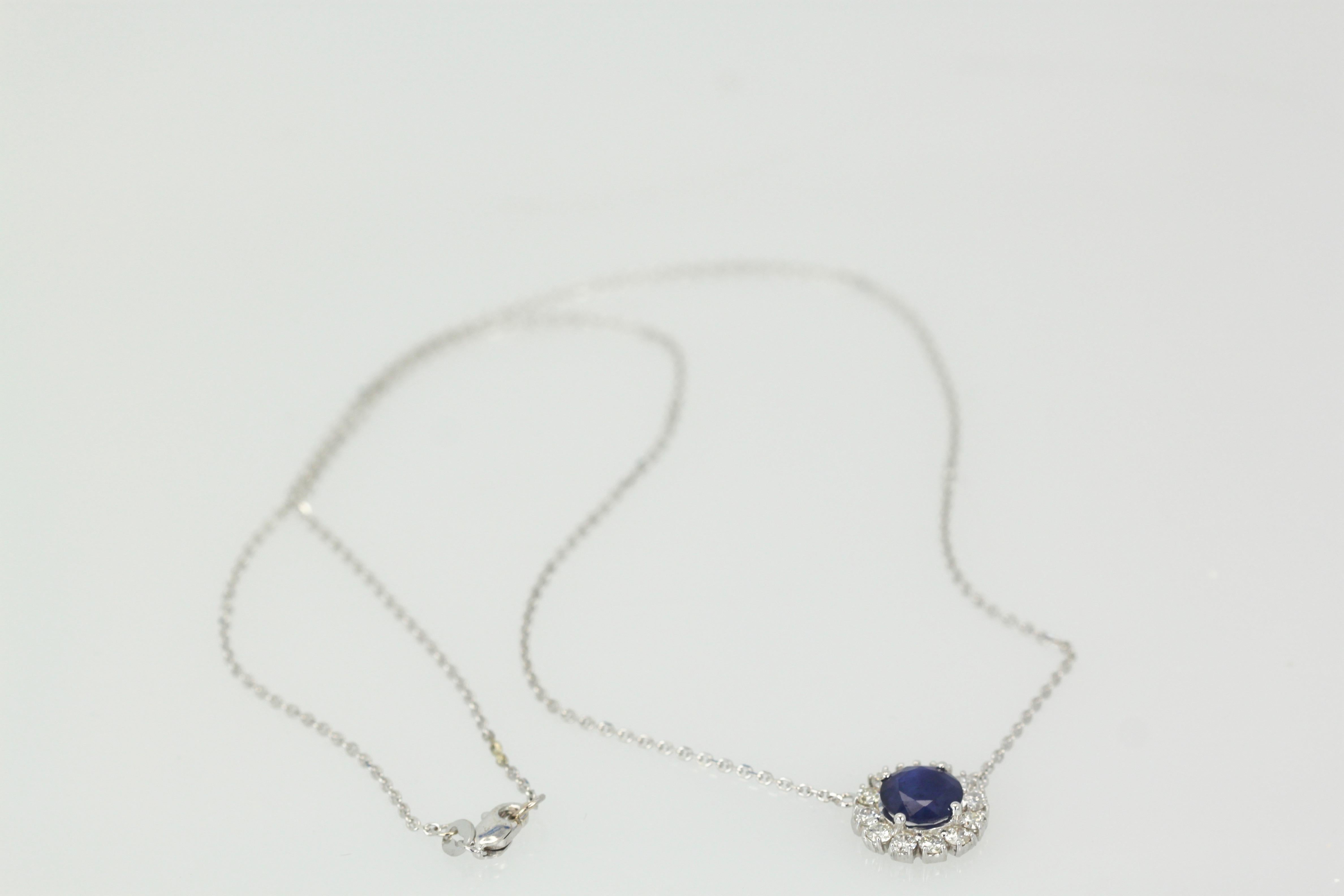 Round Cut Blue Sapphire Pendant Necklace with Diamond Surround