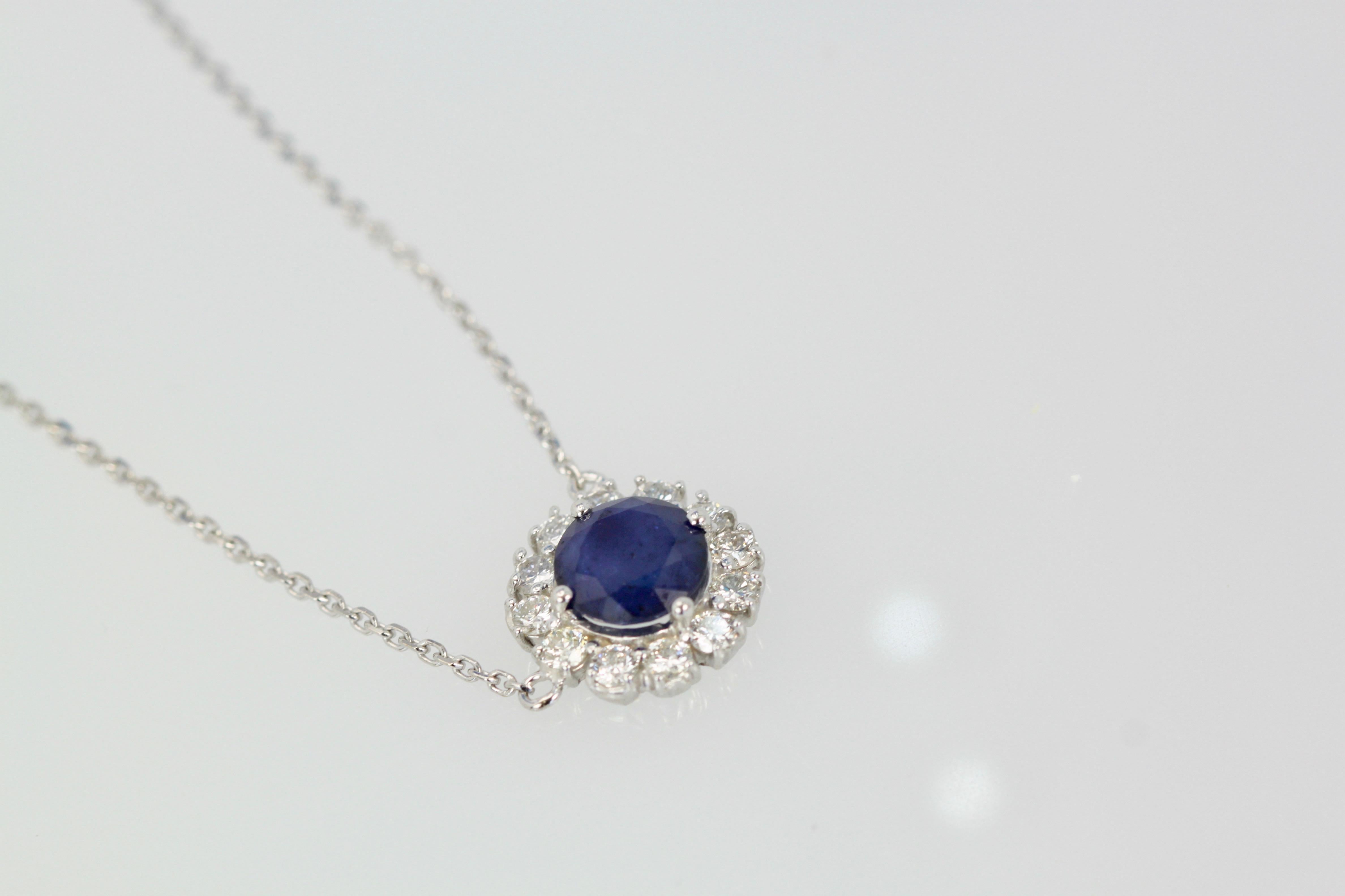 Blue Sapphire Pendant Necklace with Diamond Surround 1