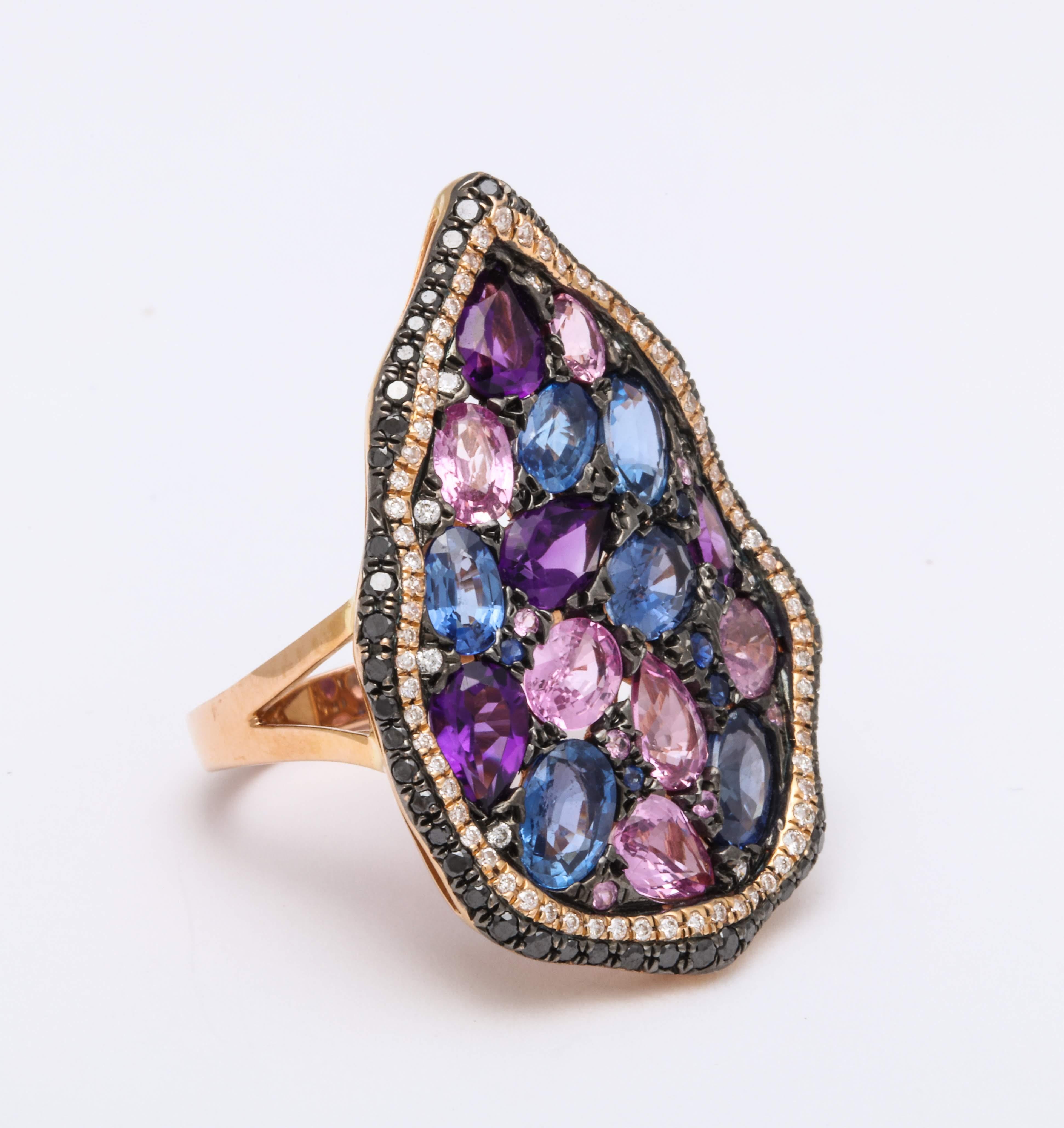 Hippie chic pear shaped motif mounted on 18 Karat yellow gold ring decorated with oval shape pink sapphire: 2.49 carats, blue sapphire: 3.35 carats, and amethyst: 1.37 carats decorated with a pave’-set round brilliant-cut diamond trim: 0.30 carats,