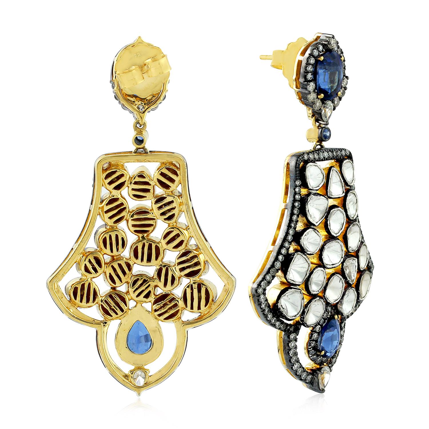 Blue Sapphire Polki Diamond Dangle Earrings with Sterling Silver and 18k Gold

8.74 carats of White Polki and round cut diamonds 5.68 Carat Kyanite and Blue Sapphire set in .925 Sterling Silver and 18k Gold Dangle Earrings.

We guarantee all