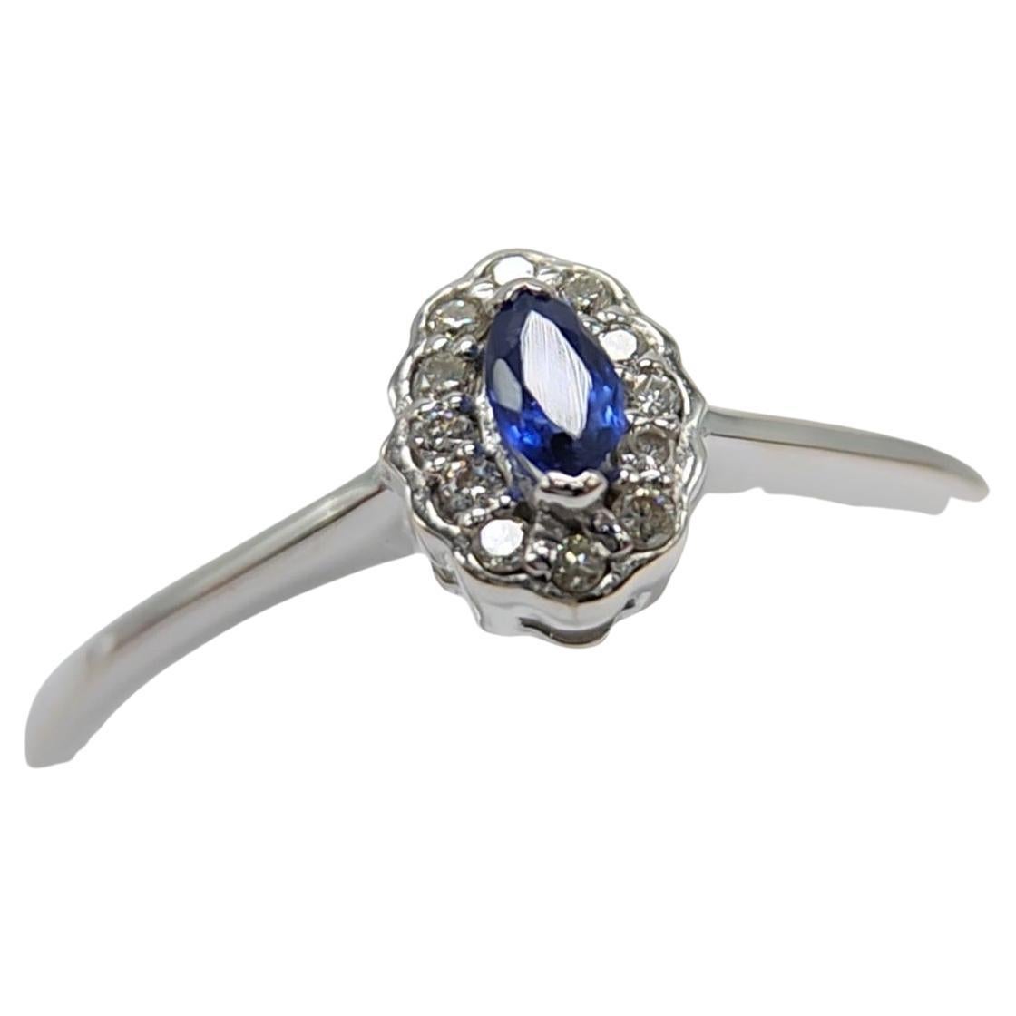 Marquis Shape Sapphire  AAA brilliant deep Blue color 0.05carat.
Total diamonds 0.06 carat G H-VS
14k White Gold 2.5 Grams, 
Finger Size 8
All stones are natural and none treated.