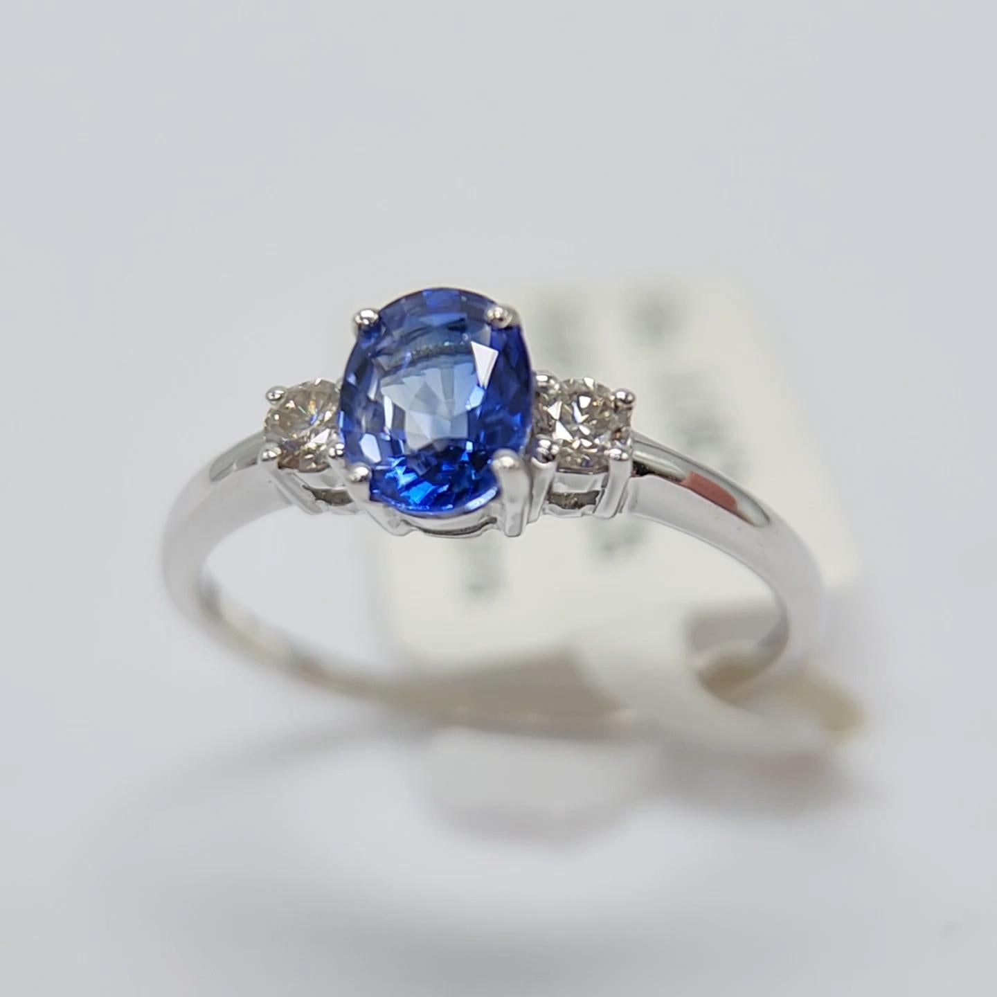 Oval Shape Sapphire  AAA brilliant deep Blue color 0.70 carat.
Total diamonds 0.06 carat G H - VVS
14k White Gold 1.75 Grams, 
Finger Size 7.5
All stones are natural and none treated.