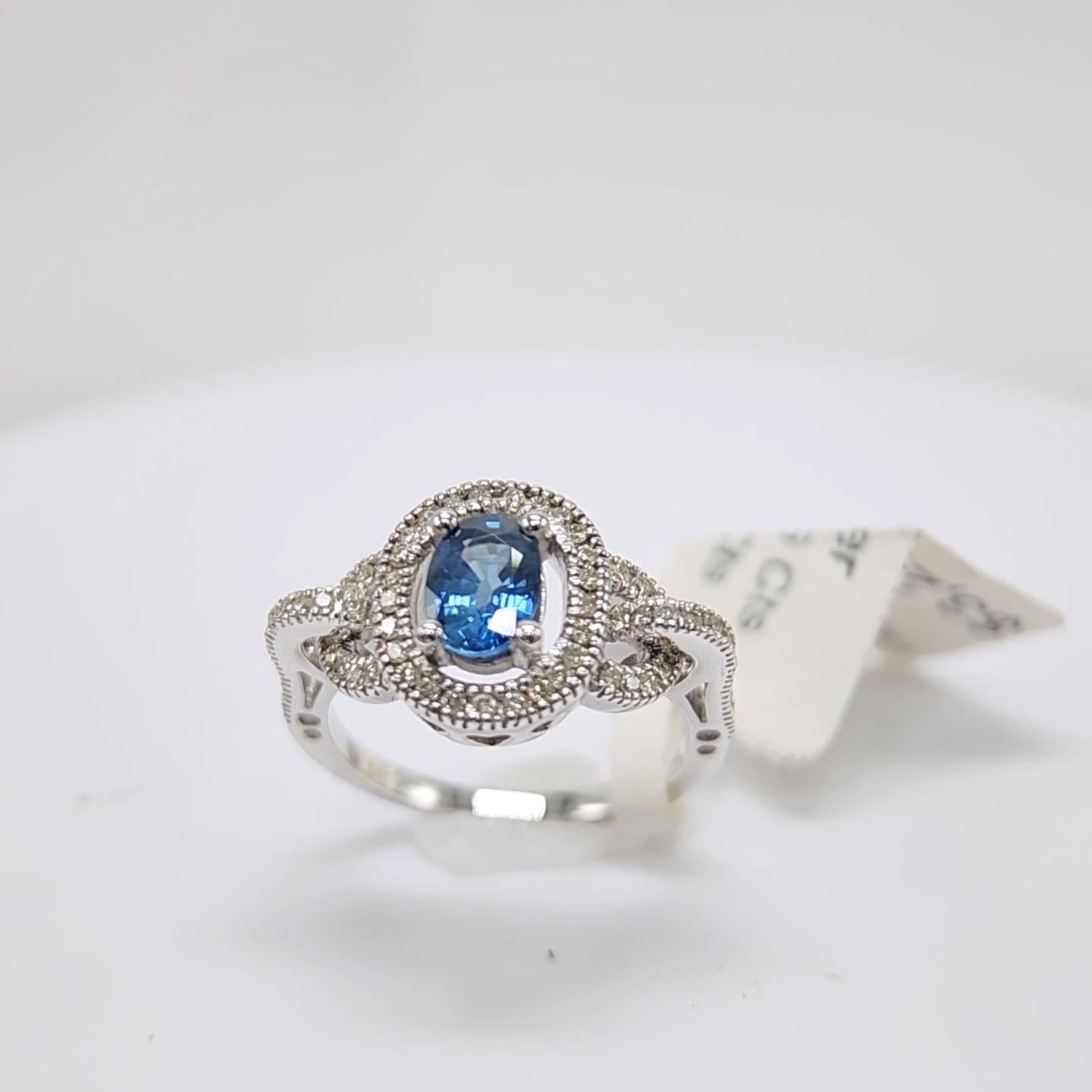Oval Cut Blue Sapphire  Ring 14 Karat White Gold with Diamonds. For Sale