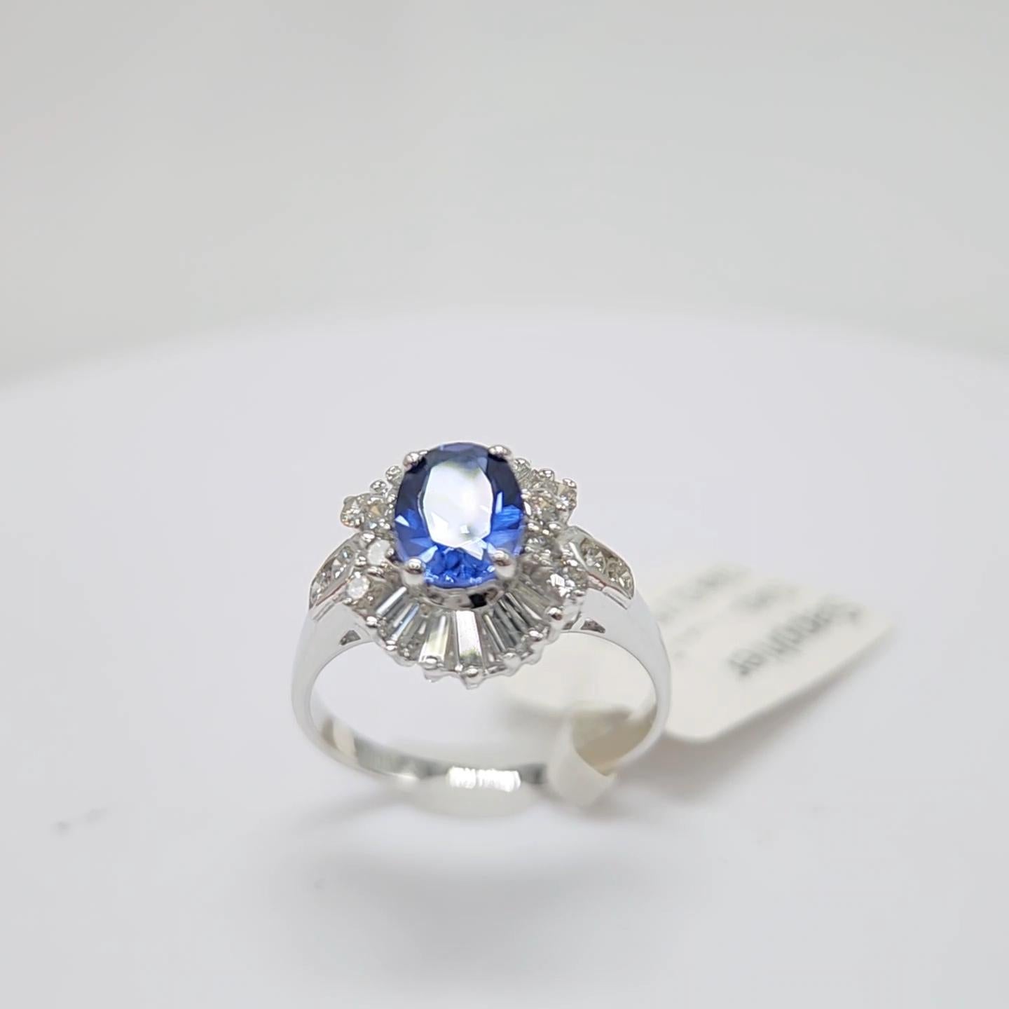 Oval Cut Blue Sapphire  Ring 14 Karat White Gold with Diamonds. For Sale