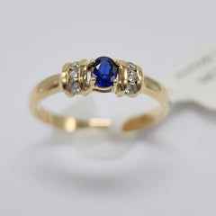 Blue Sapphire  Ring 14 Karat Yellow Gold with Diamonds.