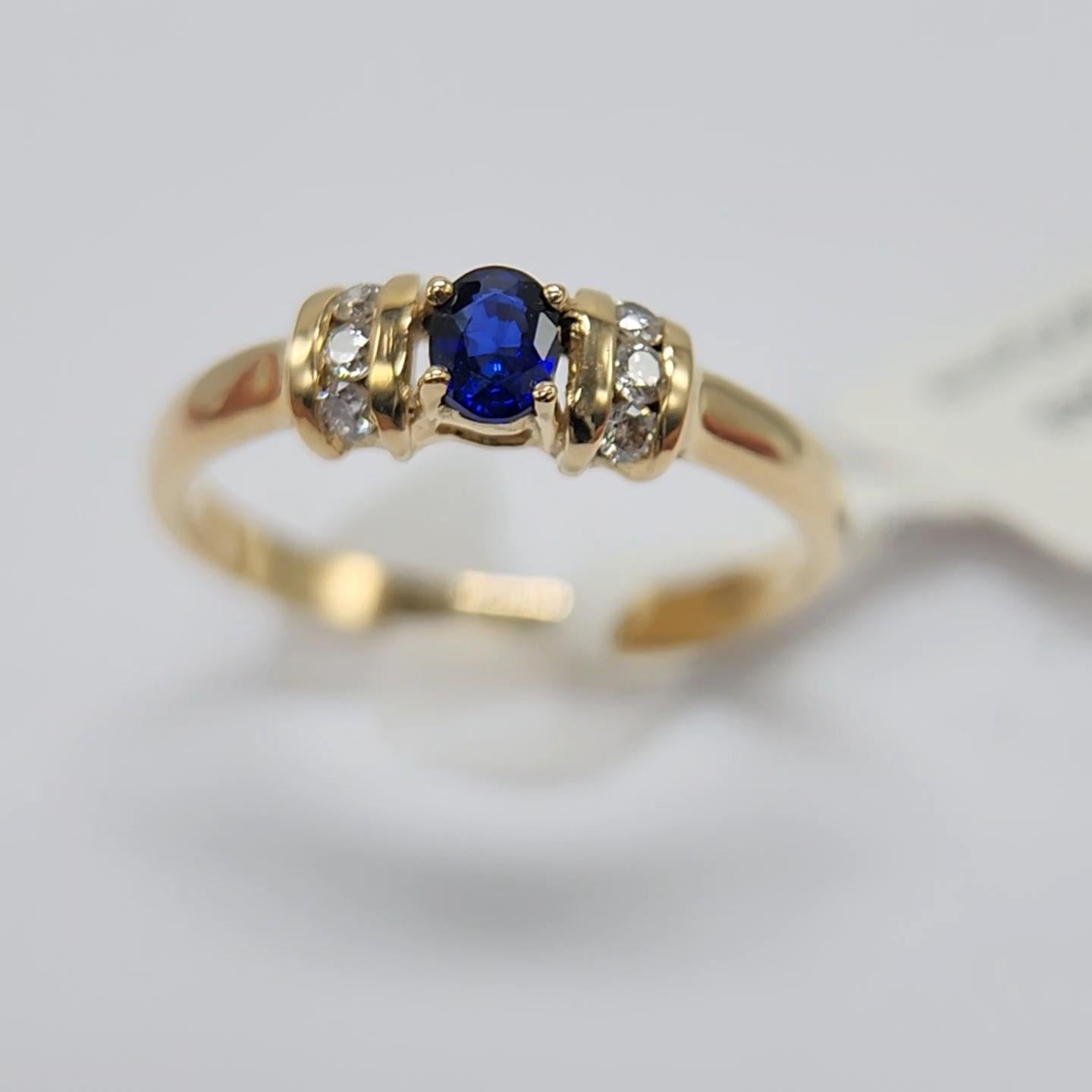 Women's Blue Sapphire  Ring 14 Karat Yellow Gold with Diamonds. For Sale