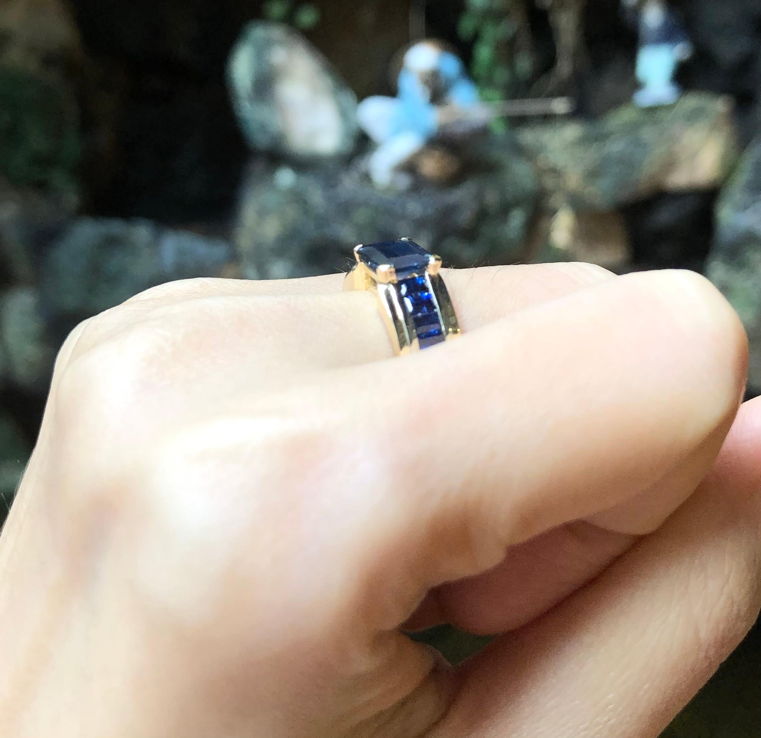 Emerald Cut Blue Sapphire Ring Set in 18 Karat Gold Settings