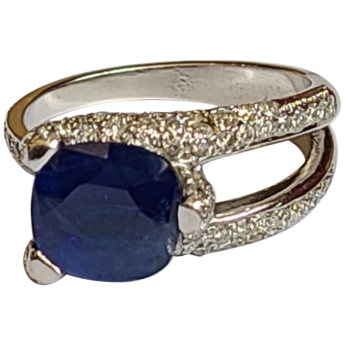 Blue Sapphire Ring Set in 18 Karat Gold with Diamonds