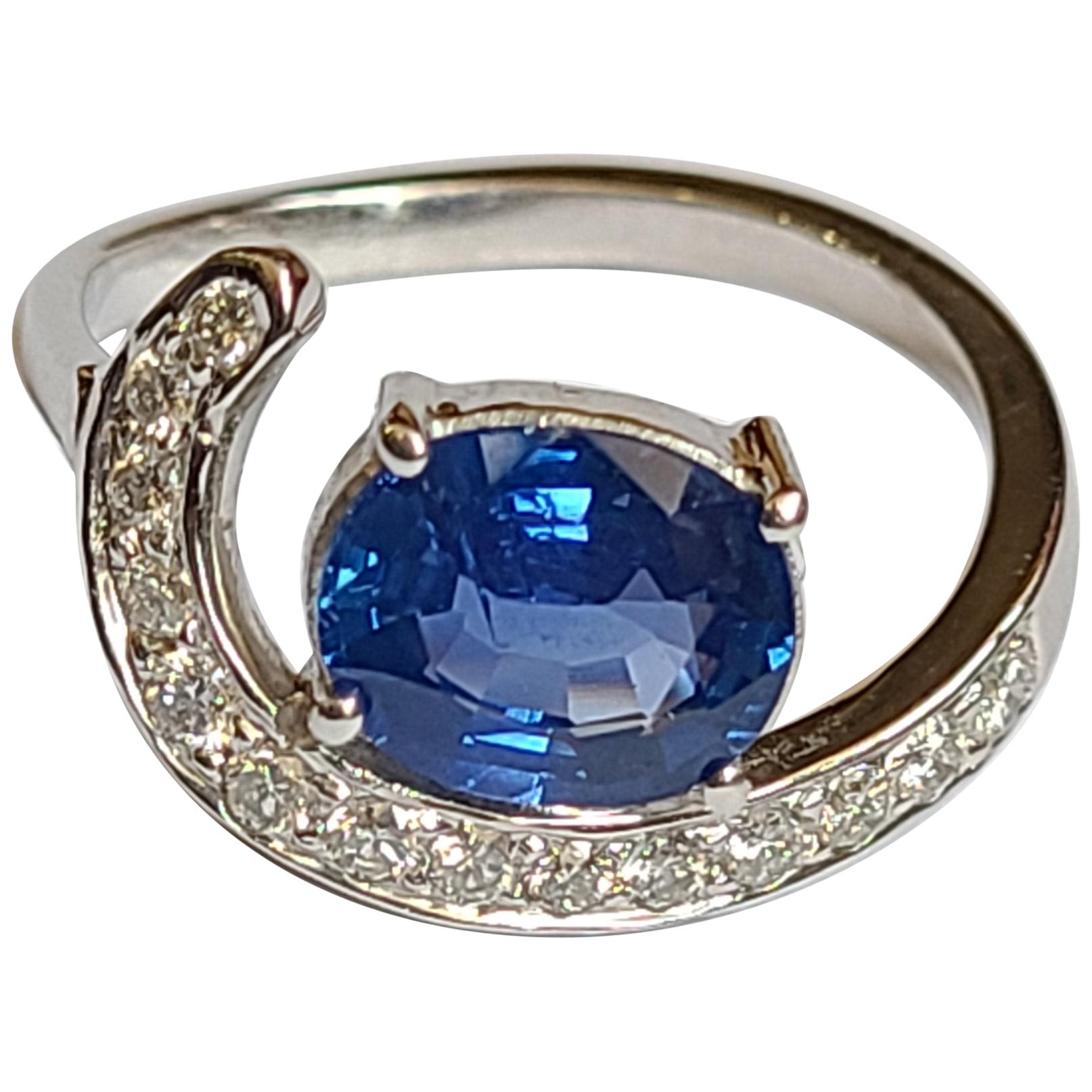 Blue Sapphire Ring Set in 18 Karat Gold with Diamonds For Sale
