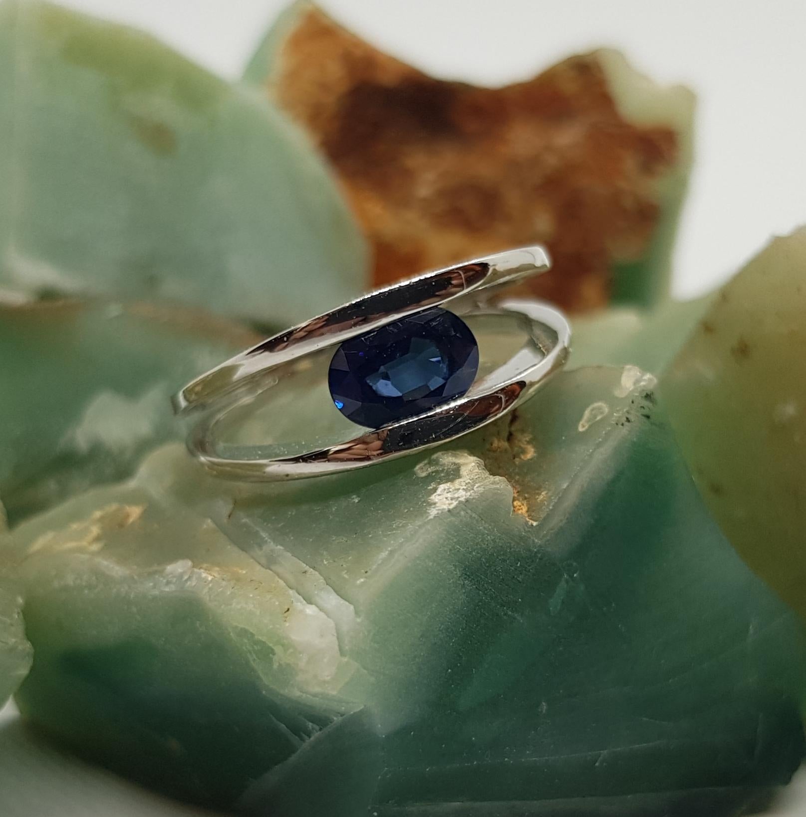 Oval Cut Blue Sapphire Ring Set in 18 Karat White Gold Settings For Sale