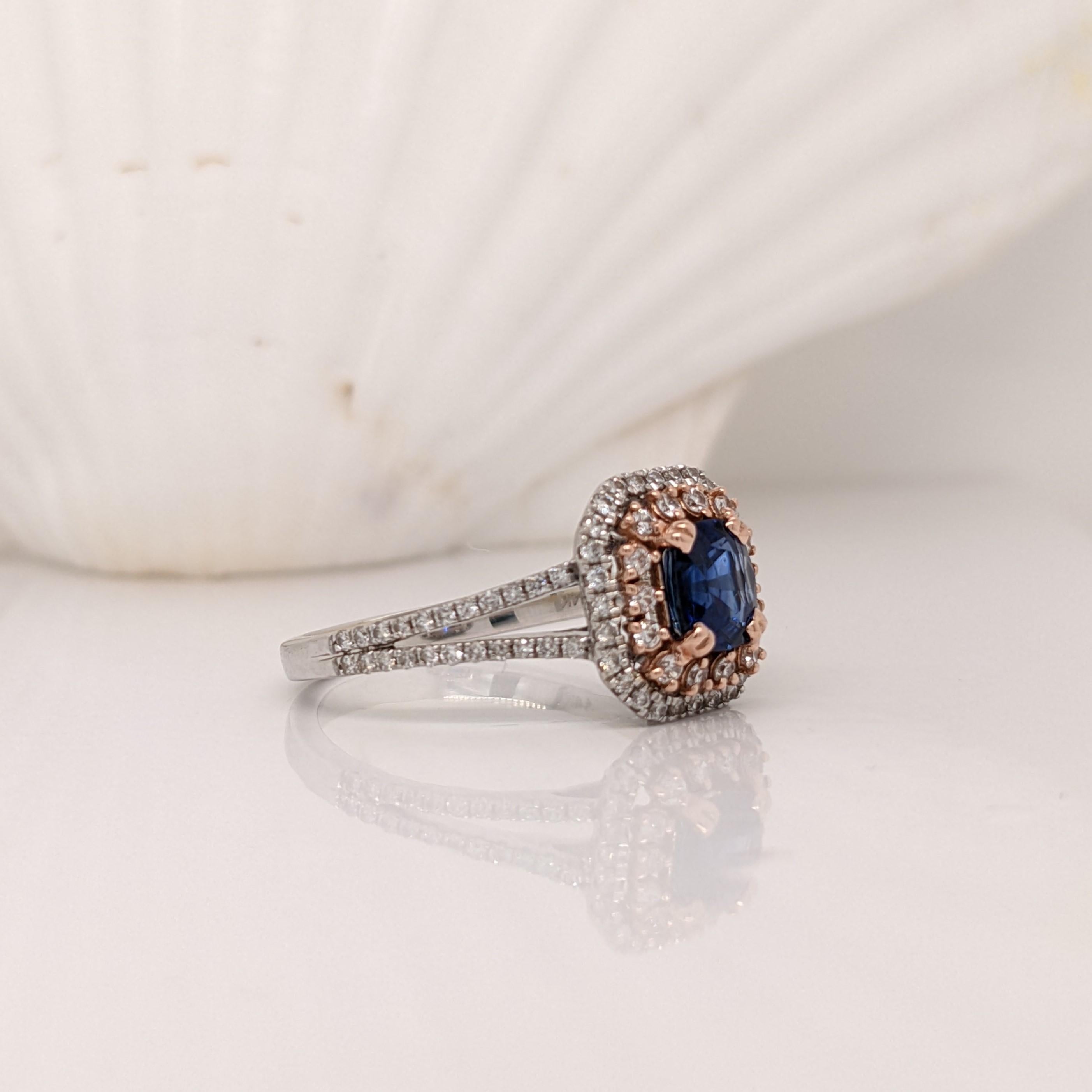 This round blue sapphire is complimented by a double halo of 2 sizes of earth mined natural diamonds set in dual tones of rose and white 14k gold. The emerald cut head shape holds this round gemstone in place securely with a double pronged setting.