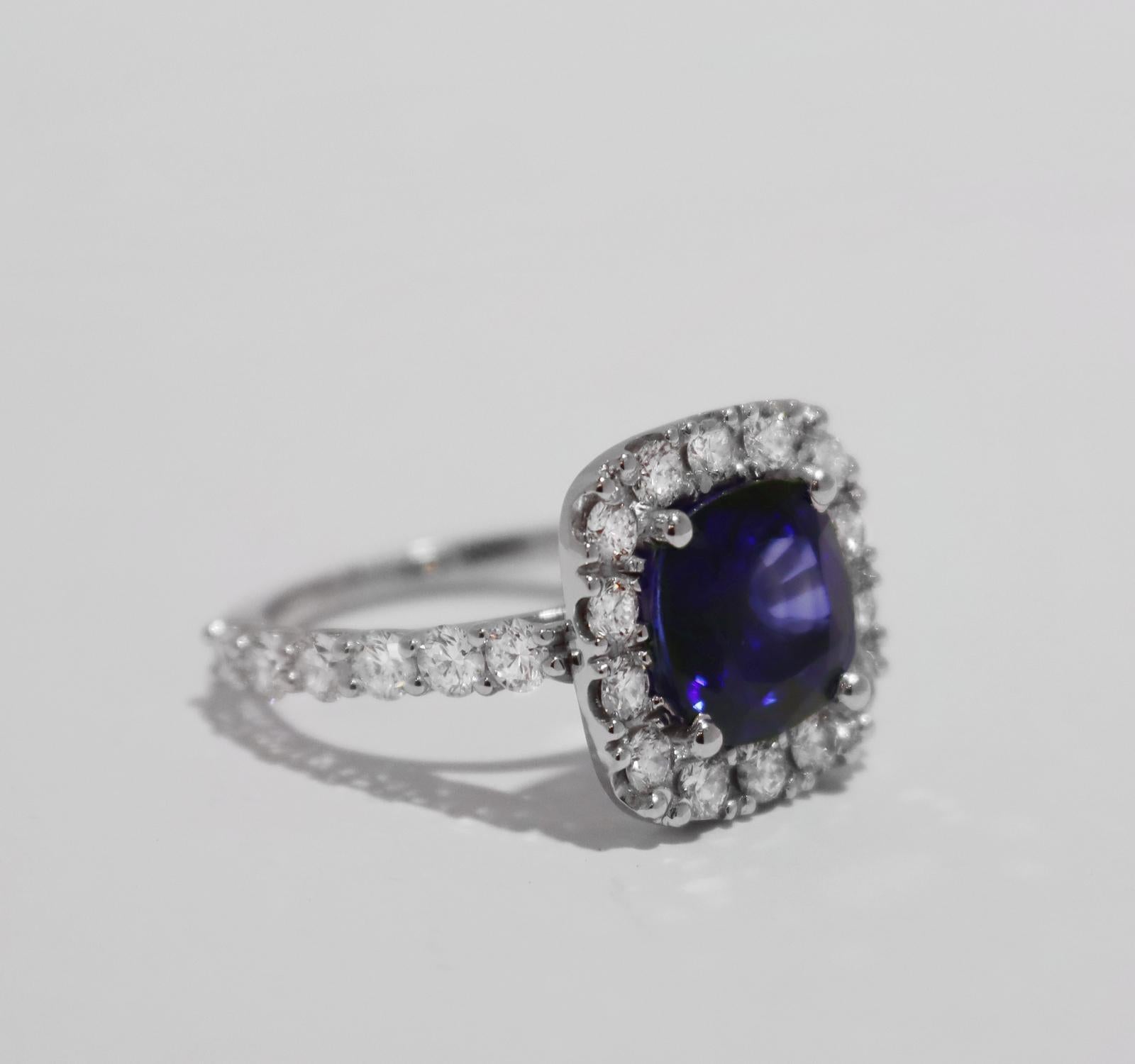 BLUE SAPPHIRE RING WITH DIAMONDS IN WHITE GOLD 

14k White gold
Ring size: 8
Sapphire: 5.98ct, 10x10mm
Diamonds: 2.4ct, VS clarity, E-F color

Retail: $7,900