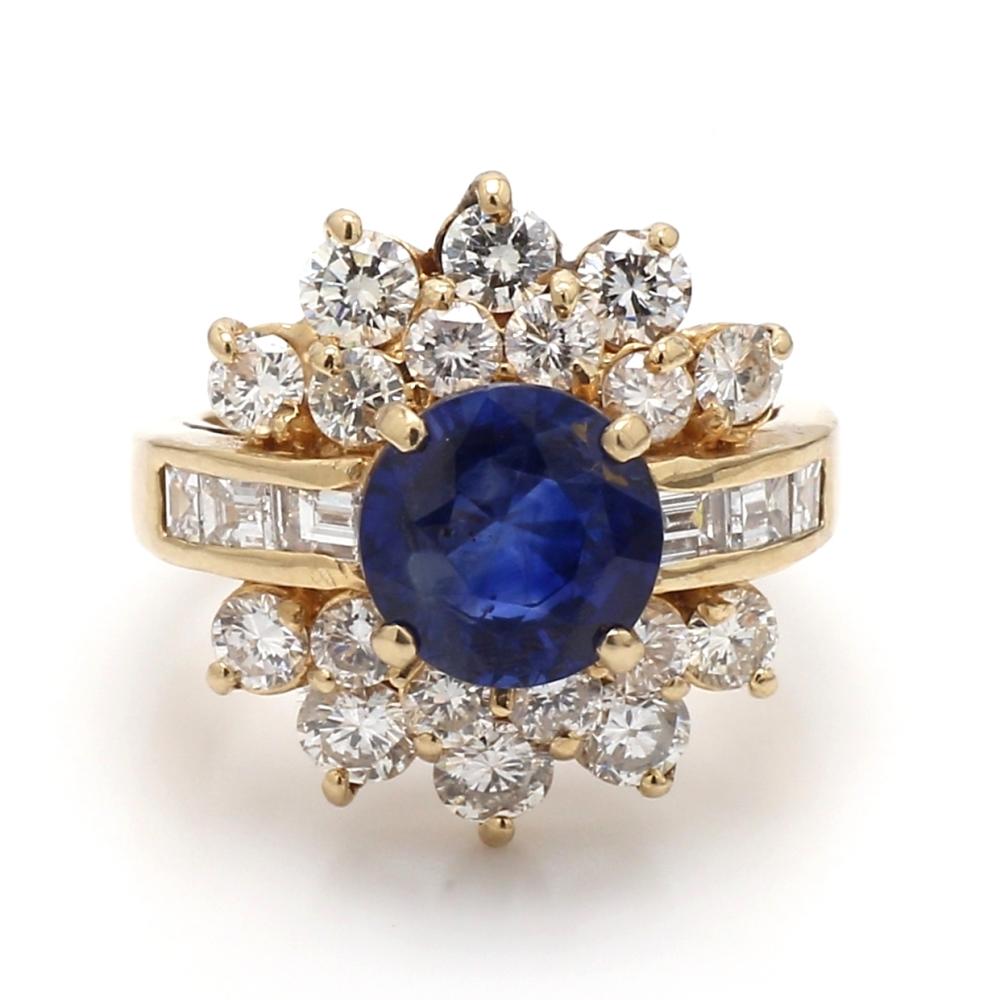 Round Cut Blue Sapphire Ring with Round and Baguette Diamond Accents For Sale