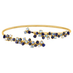 Bangle rotondo con zaffiro blu in oro giallo 18 carati