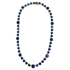 Runde Halskette mit blauem Saphir aus 18 Karat Gelbgold und schwarzem Rhodium