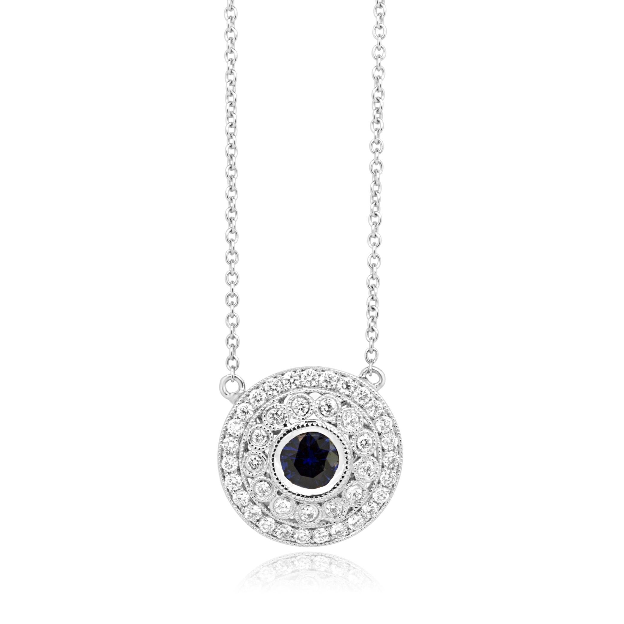 Blue Sapphire Round 0.53 Carat Encircled in a Double Halo of White Round Diamonds 0.78 Carat in Stunning 14K White Gold Pendant With Diamond By Yard Necklace.

Style available in different price ranges. Prices are based on your selection of 4C's