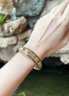 Blue Sapphire, Ruby 0.15 and Diamond Elephant Bangle set in 18K Gold Settings