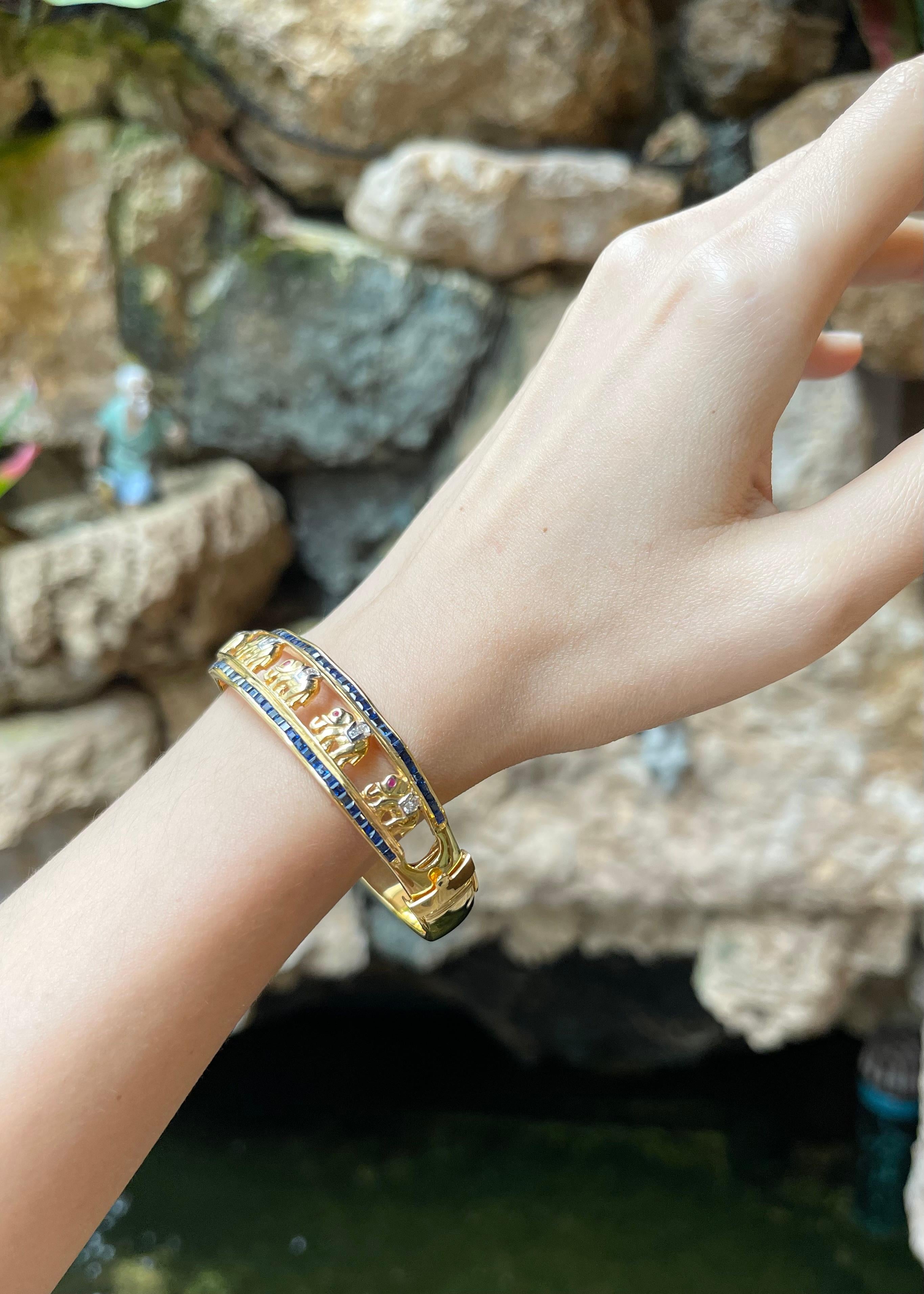 Contemporary Blue Sapphire, Ruby 0.15 and Diamond Elephant Bangle set in 18K Gold Settings For Sale