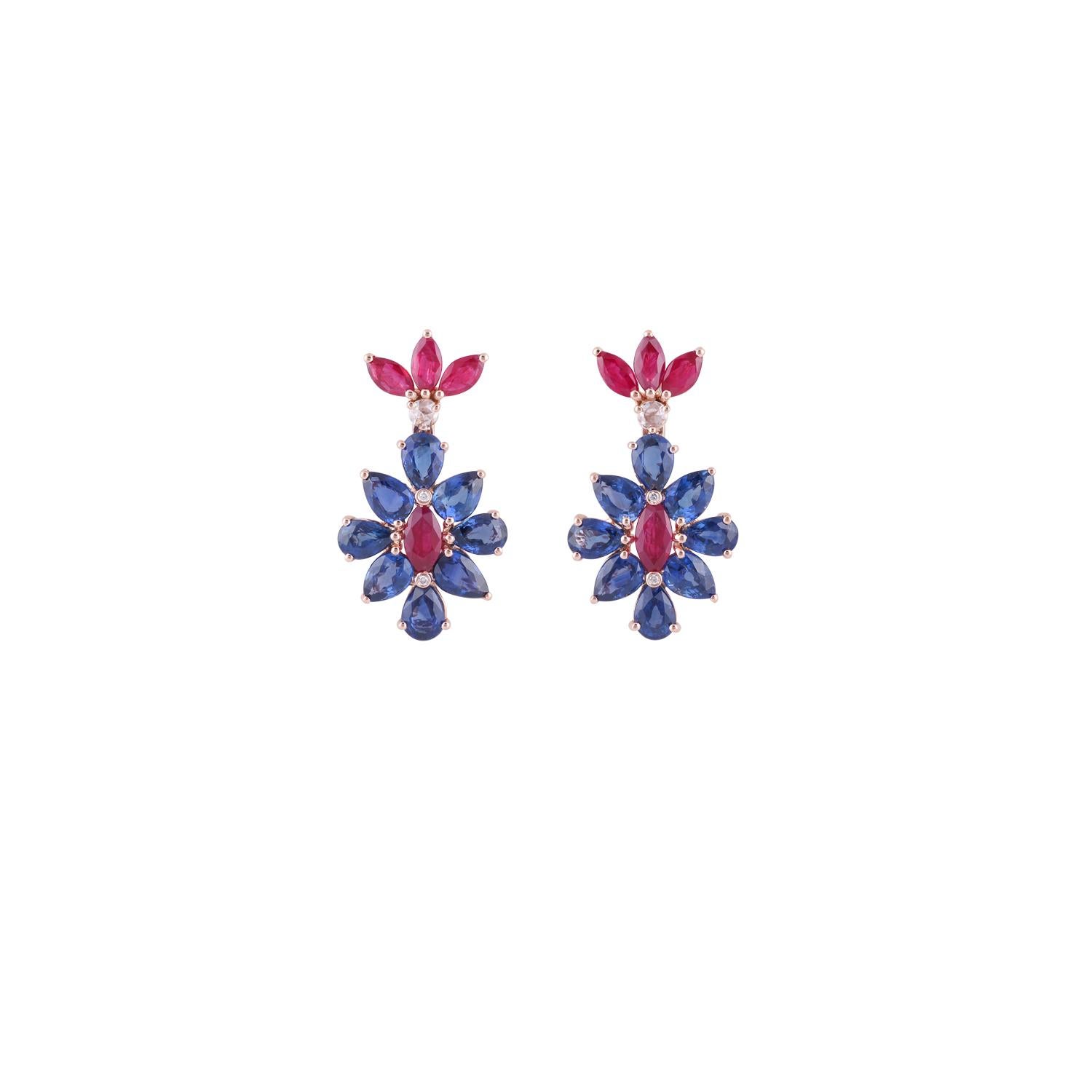 This is an exclusive pair of blue sapphire, ruby & diamond earrings studded in 18k rose gold features 16 pieces of pear shaped blue sapphire weight 7.84 carats with 8 pieces of marquise shaped ruby weight 2.46 carat & round shaped diamonds weight