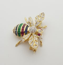 Blue Sapphire, Ruby, Emerald and Brown Diamond Brioche in 18 Karat Gold Settings