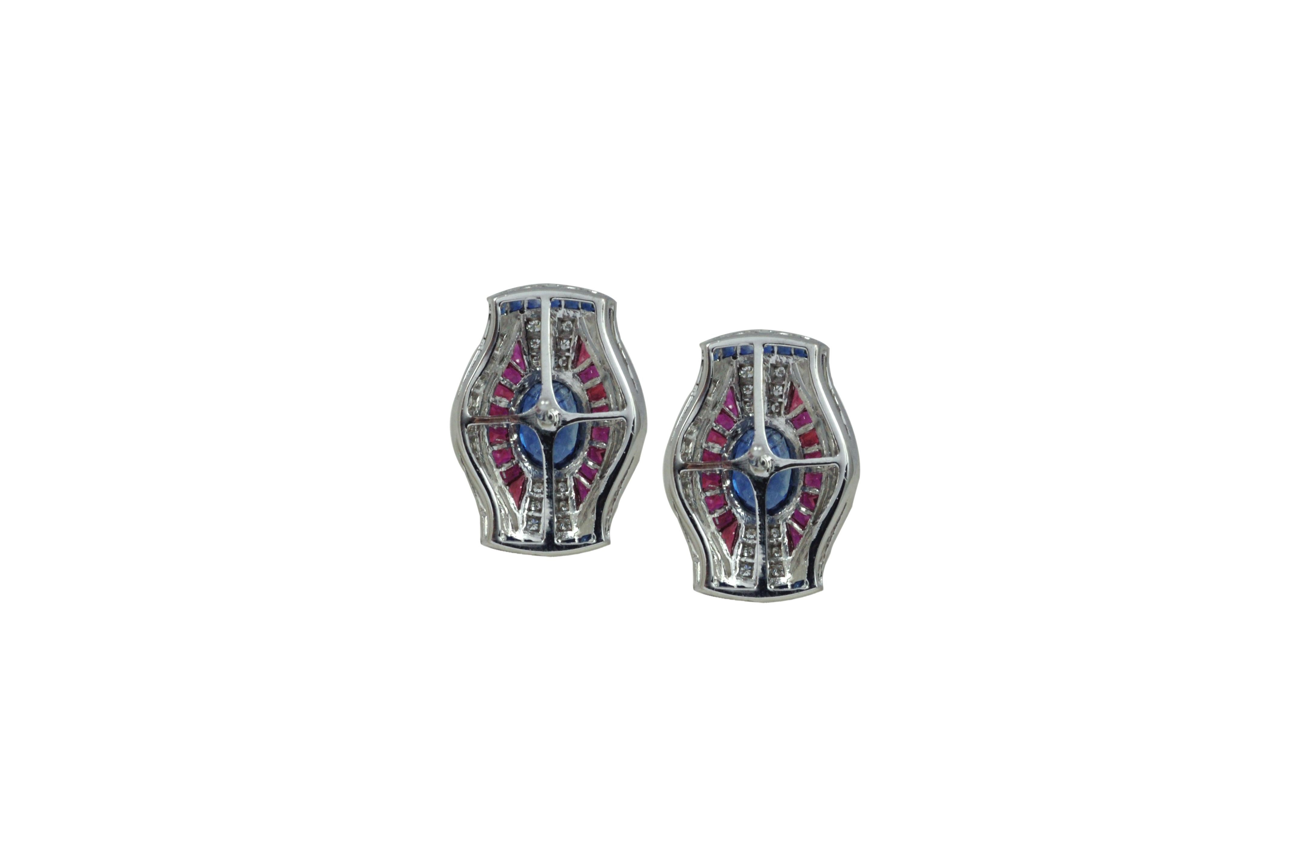 Blue Sapphire 2.68 carats, Blue Sapphire 0.98 ct, Ruby 1.91 carats with Diamond 0.49 carats Earrings in 18 karat White Gold Settings


Width: 1.8 cm
Length: 2.0 cm
Total Weight: 10.32 grams

